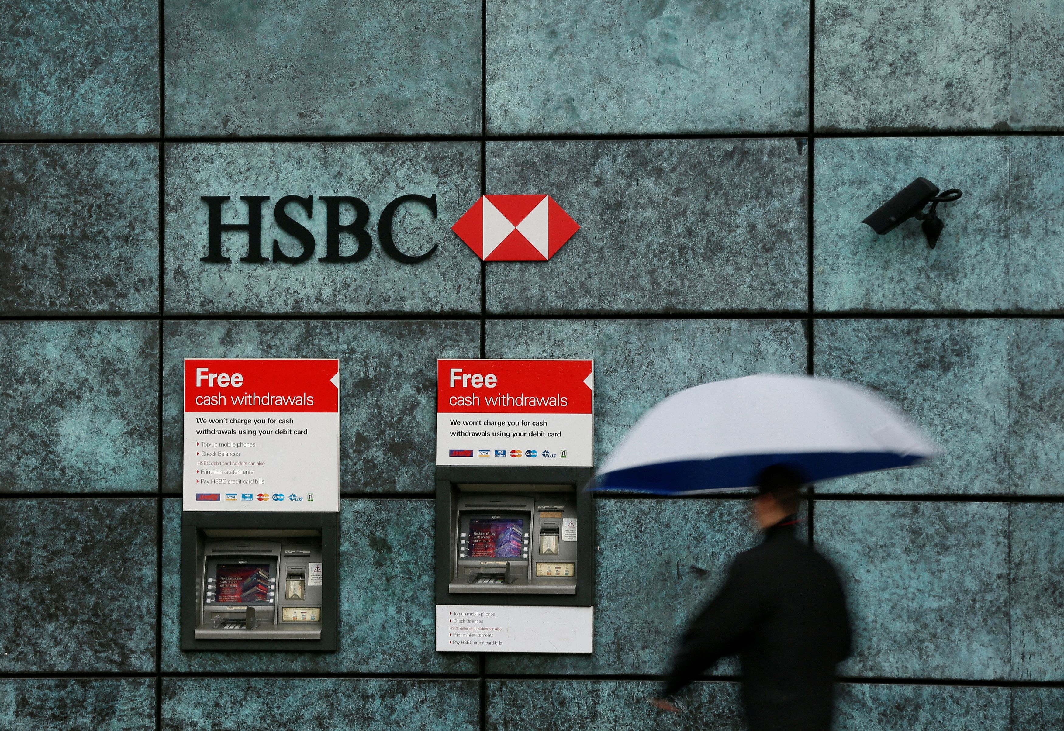 A man walks past a HSBC bank branch in London