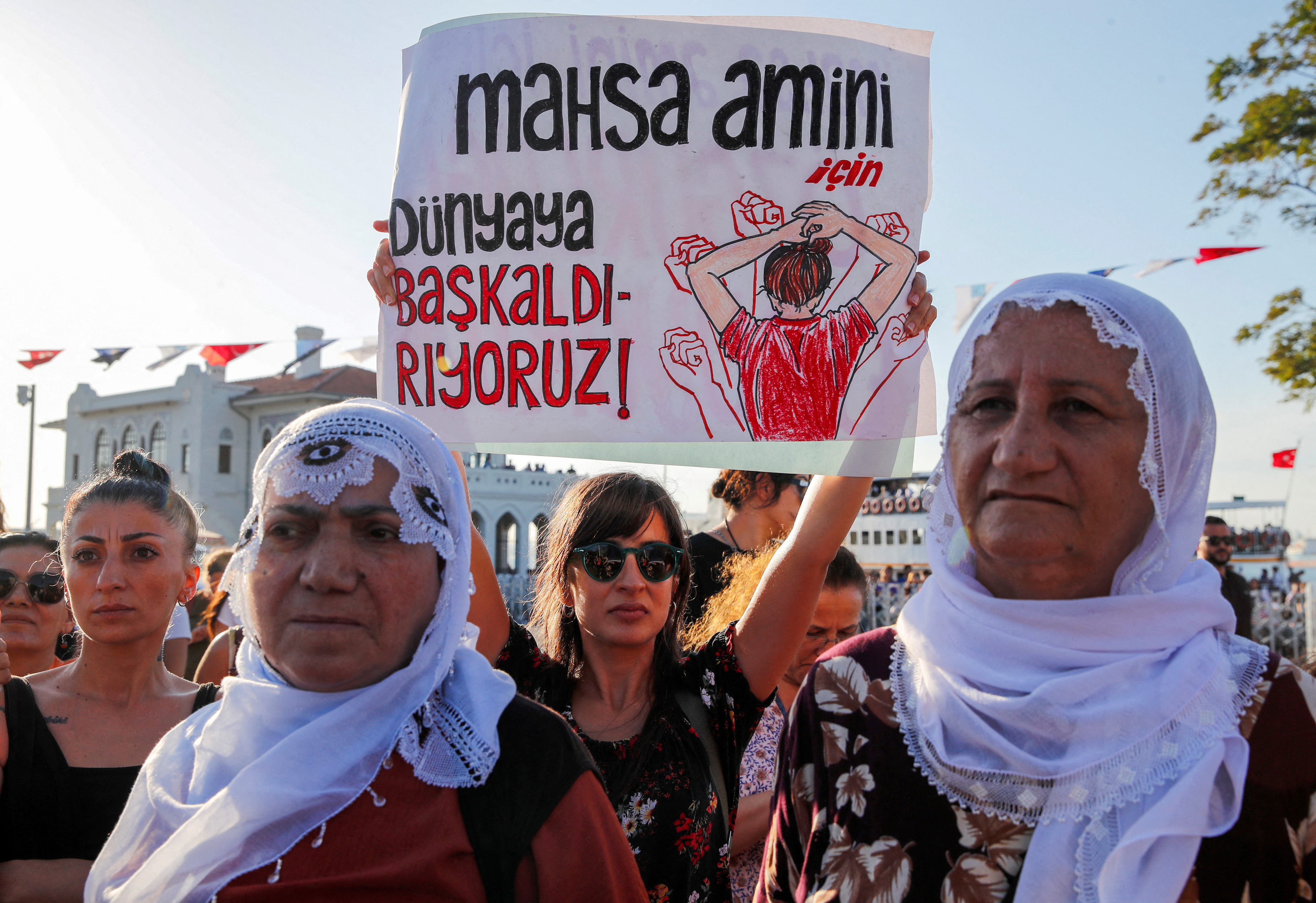 Women take part in a rally on the first anniversary of the death of Mahsa Amini in Istanbul