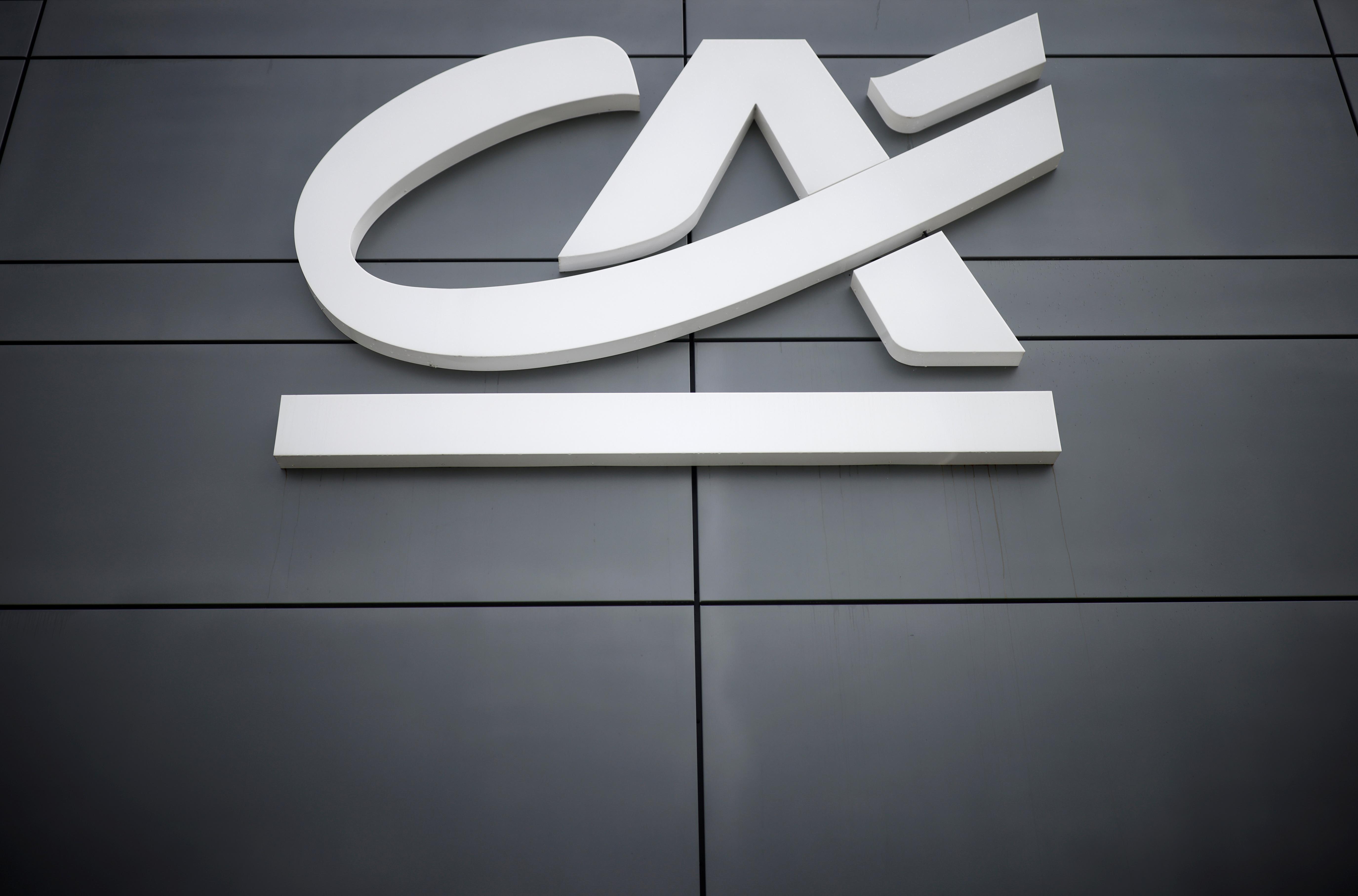 A Credit Agricole logo is seen outside a bank office in Reze near Nantes