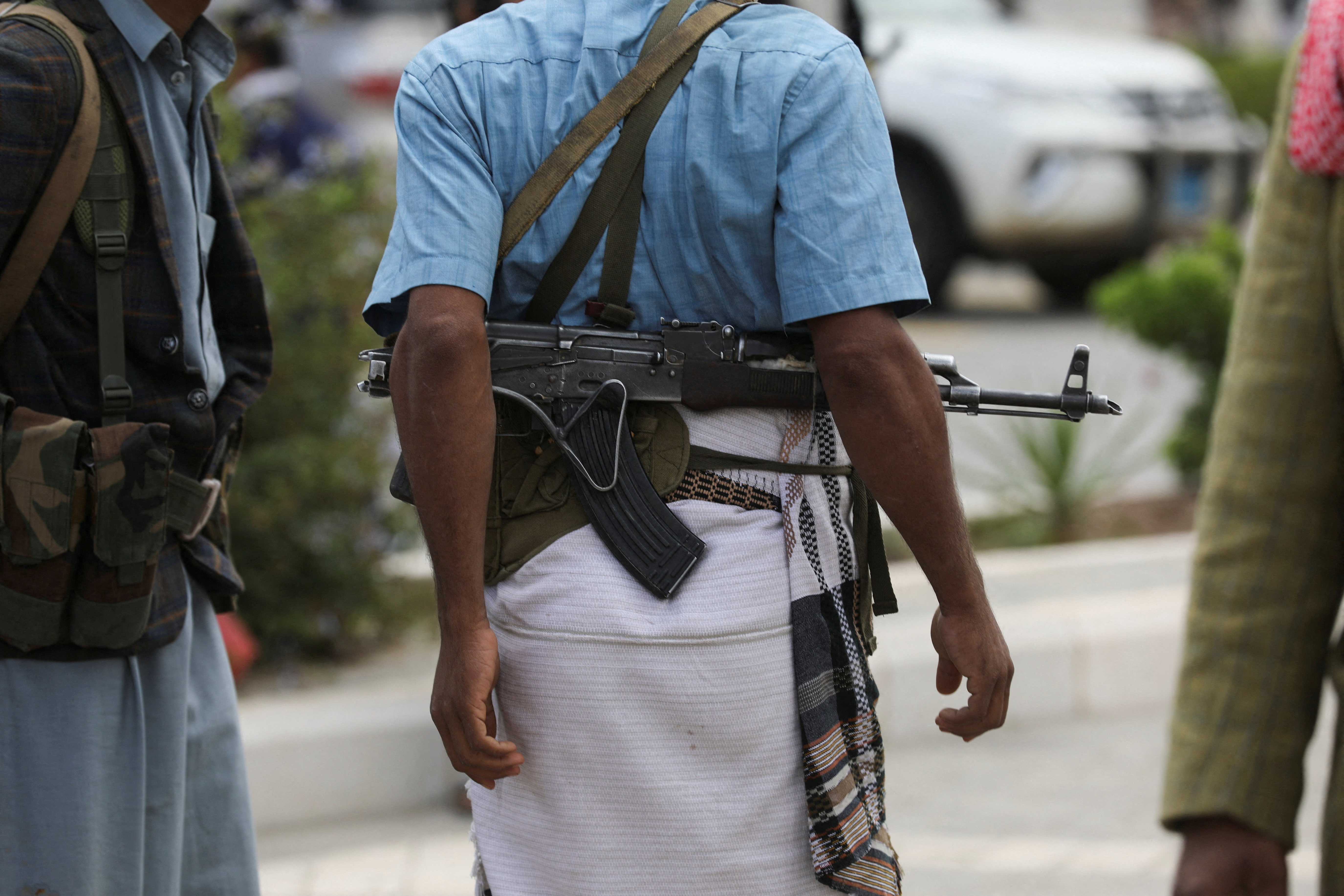 Tribesman carries a rifle during a prisoner release by the Houthis in Sanaa