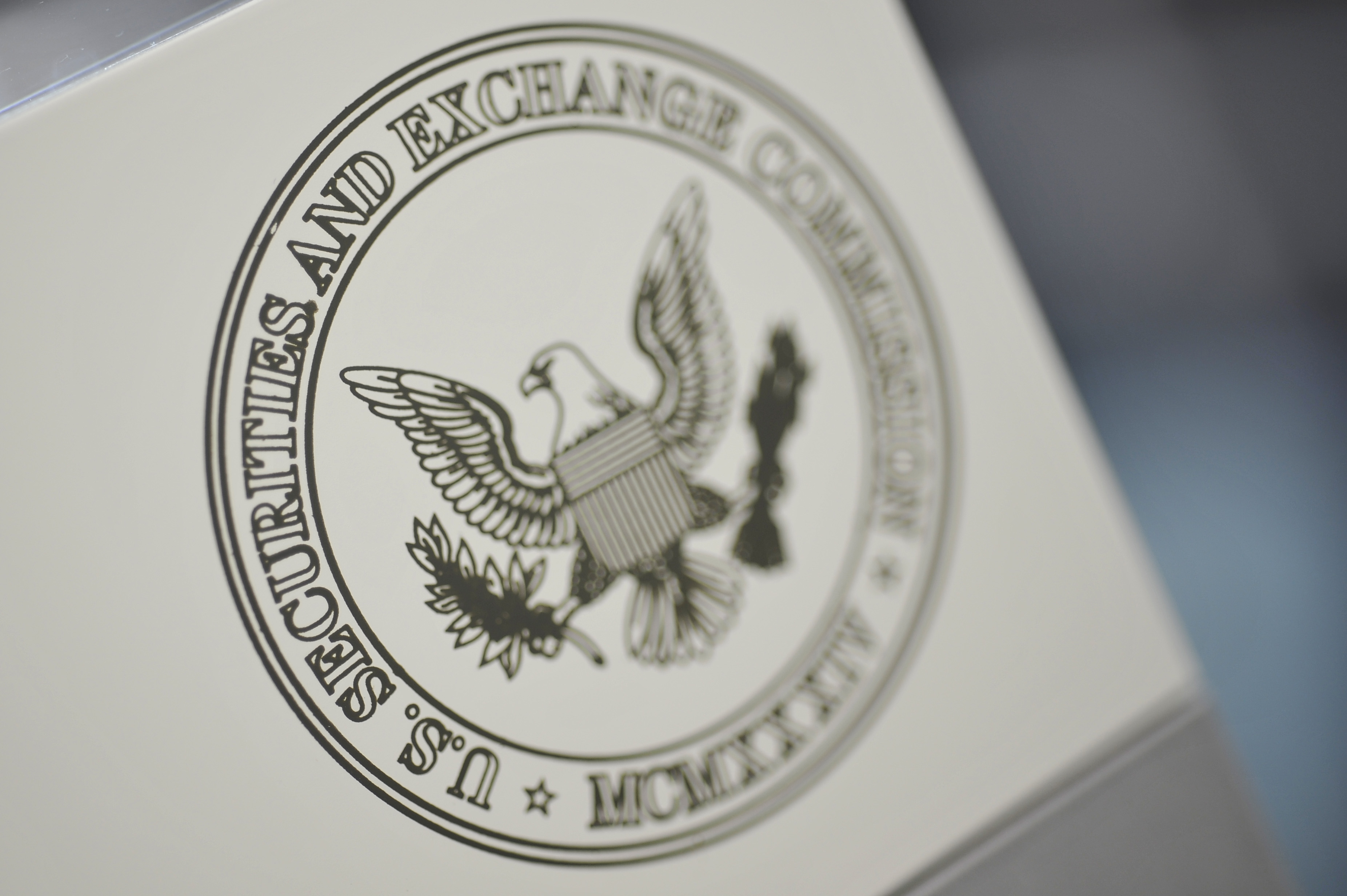 The U.S. Securities and Exchange Commission logo adorns an office door at the SEC headquarters in Washington, June 24, 2011. Picture taken June 24, 2011. REUTERS/Jonathan Ernst