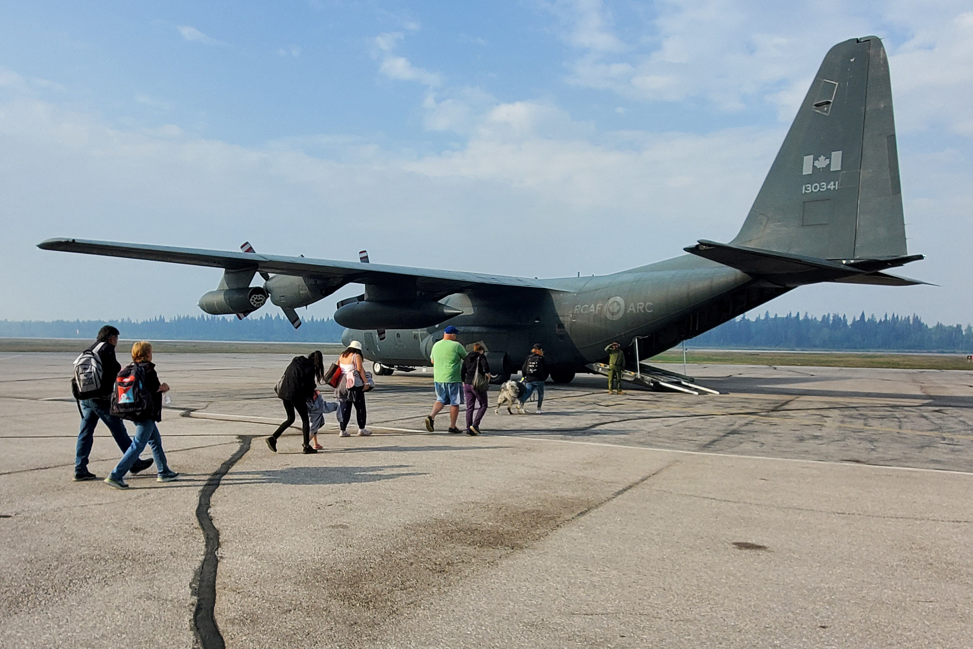 People being evacuated from an approaching wildfire in Hay River