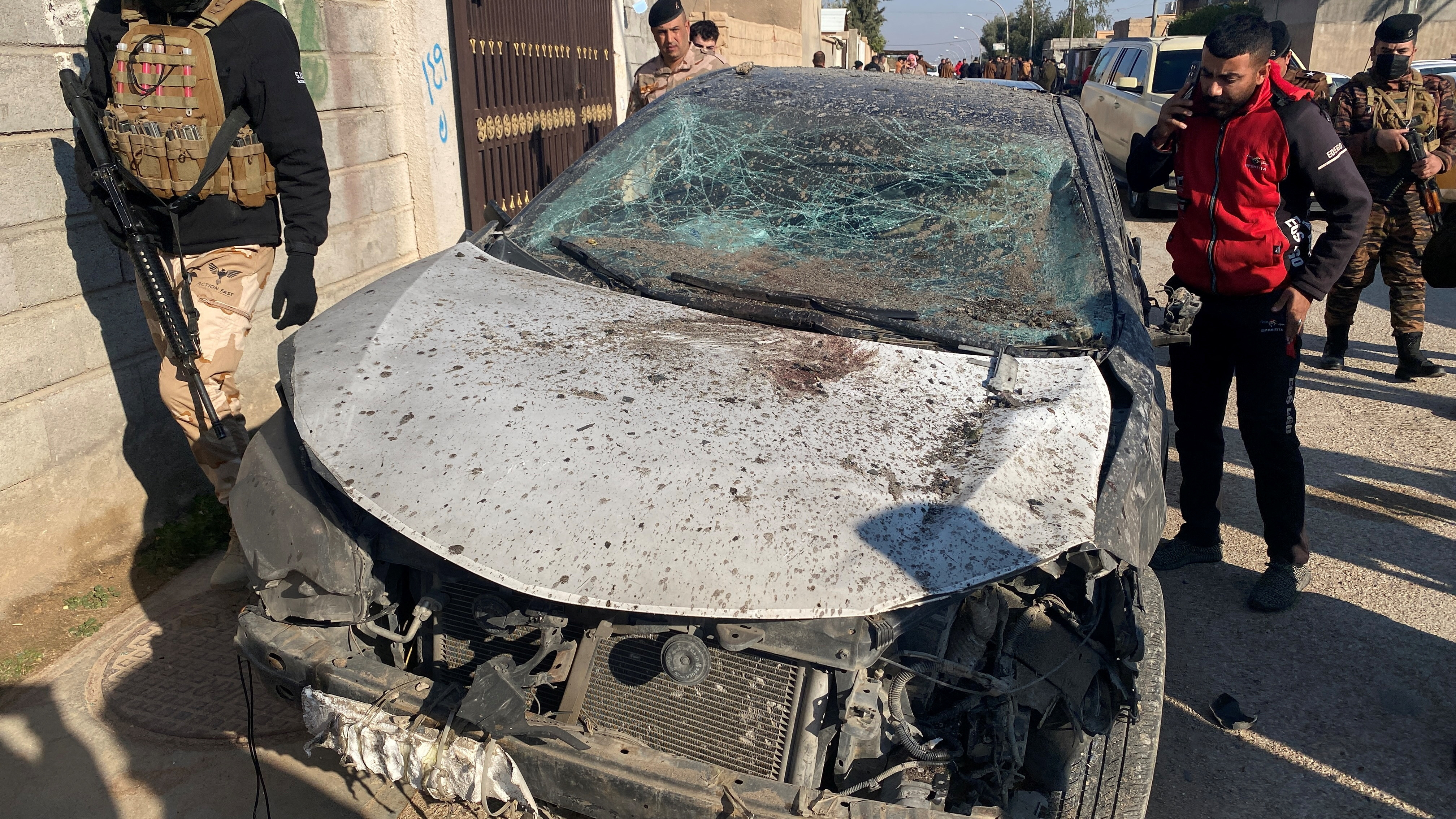 A damaged car is pictured at the site of a U.S. airstrike in al-Qaim
