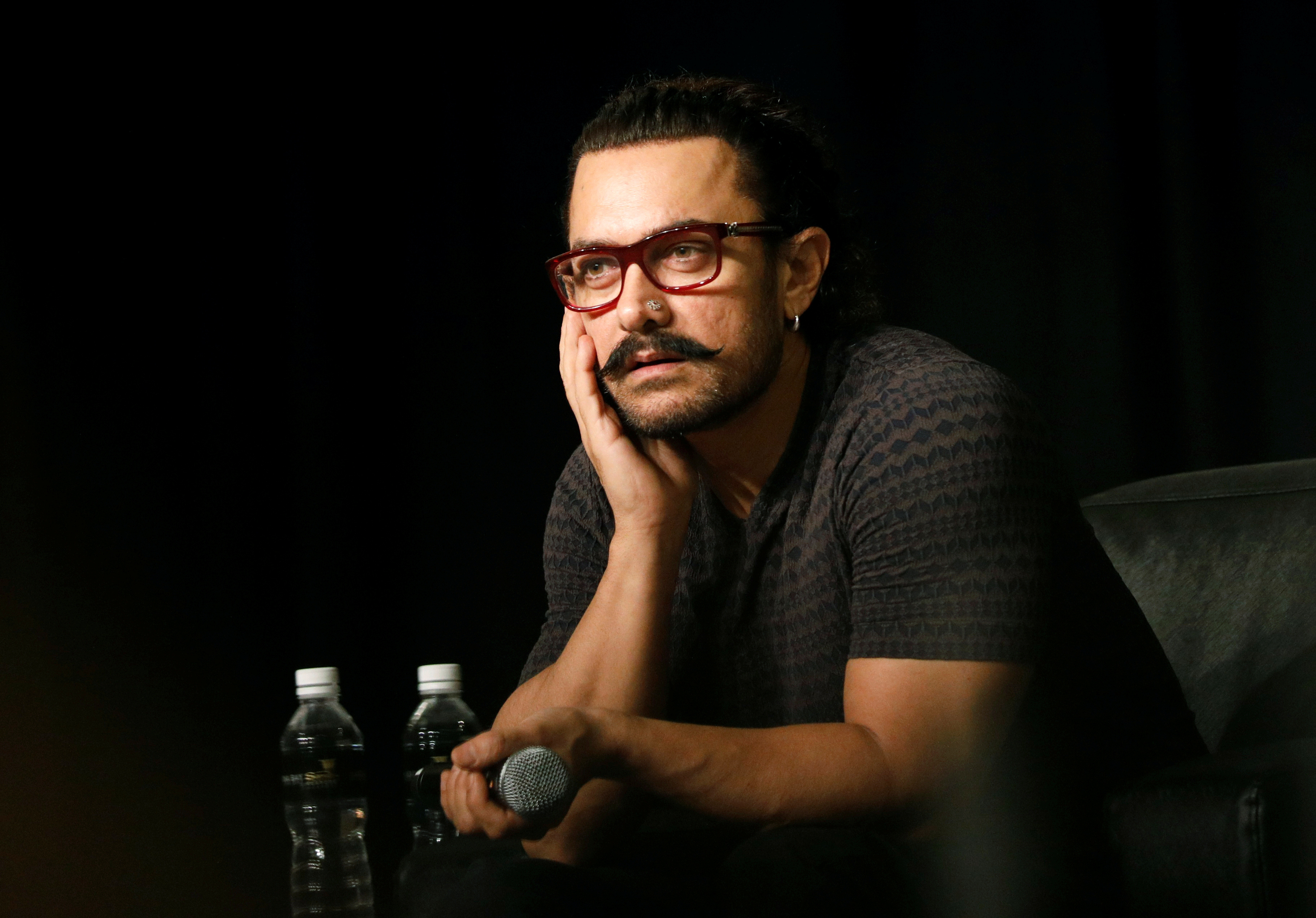 Actor Aamir Khan speaks during a news conference in Singapore