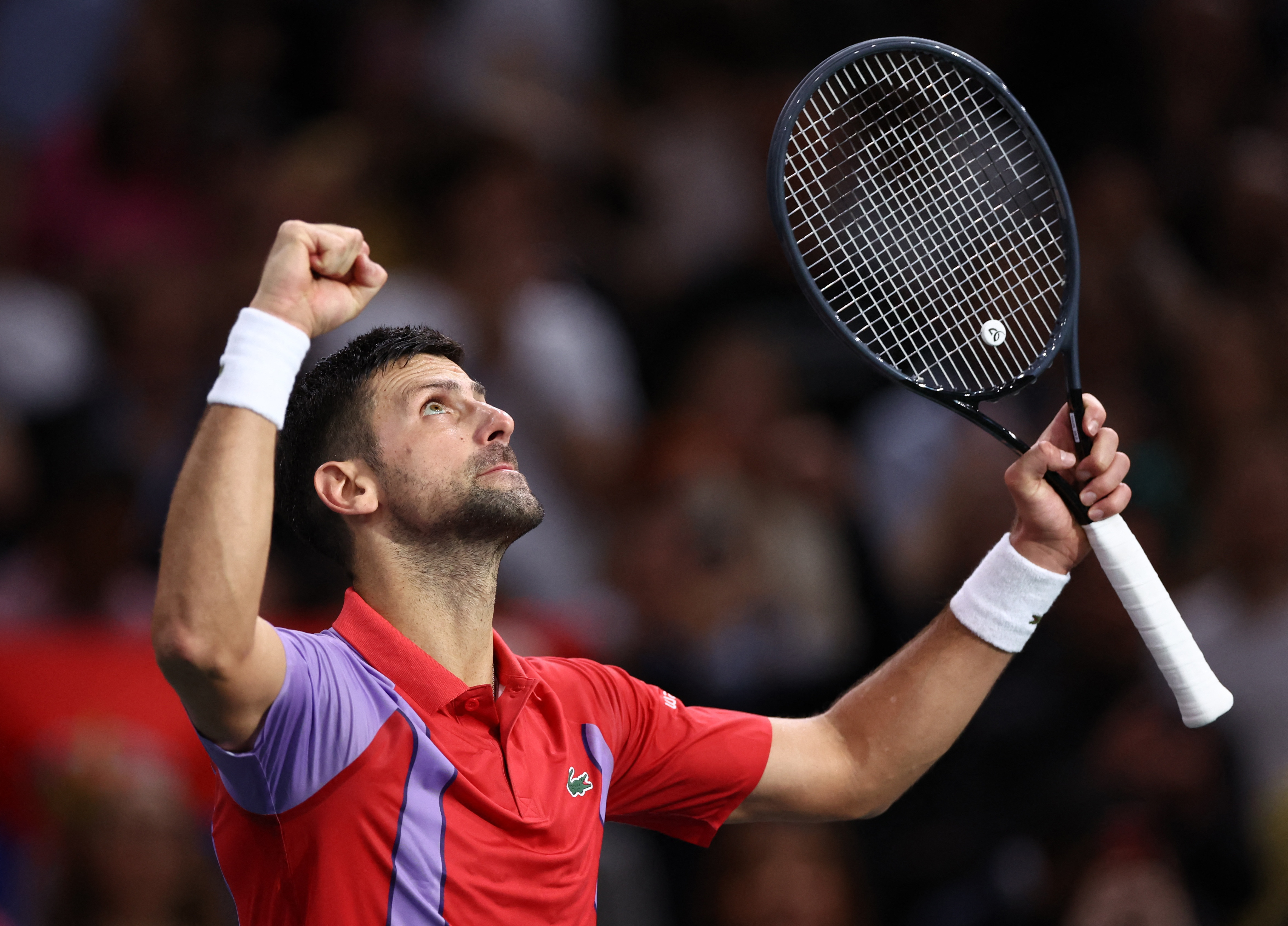 Djokovic battles back to advance to Paris quarter-finals Reuters