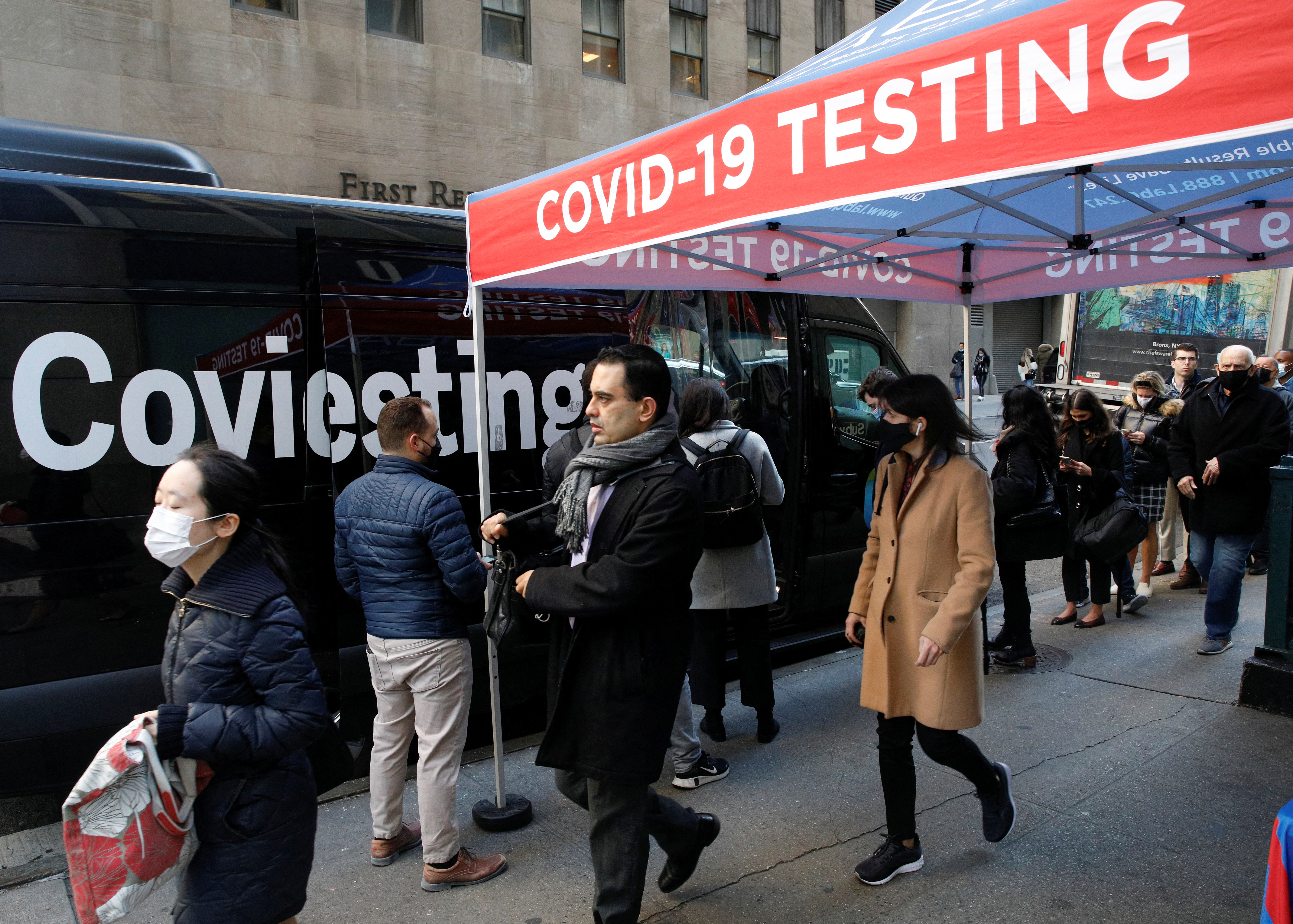 People wait in line to take coronavirus disease (COVID-19) tests at pop-up testing site in New York