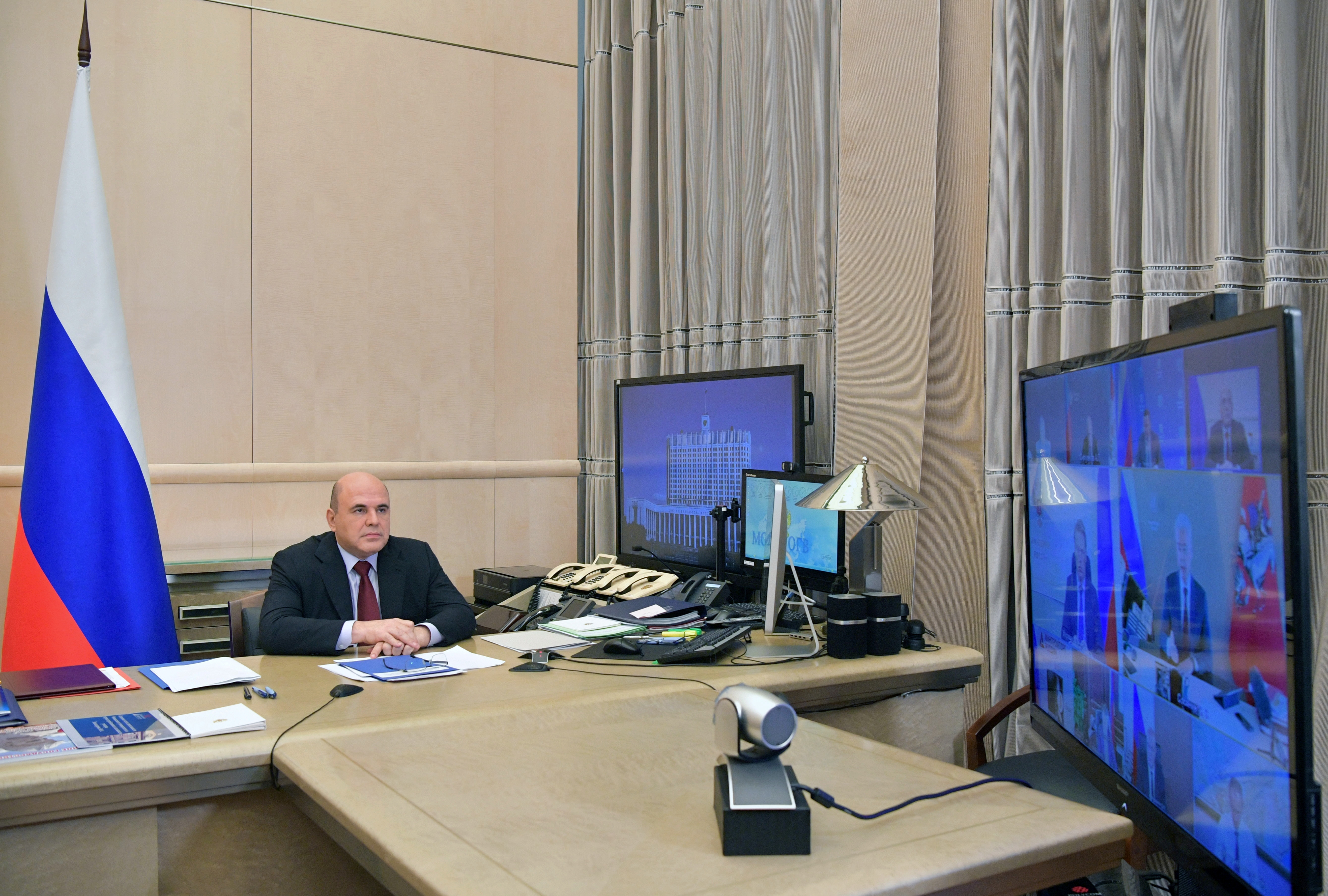 Russian Prime Minister Mikhail Mishustin chairs a meeting via a video link in Moscow