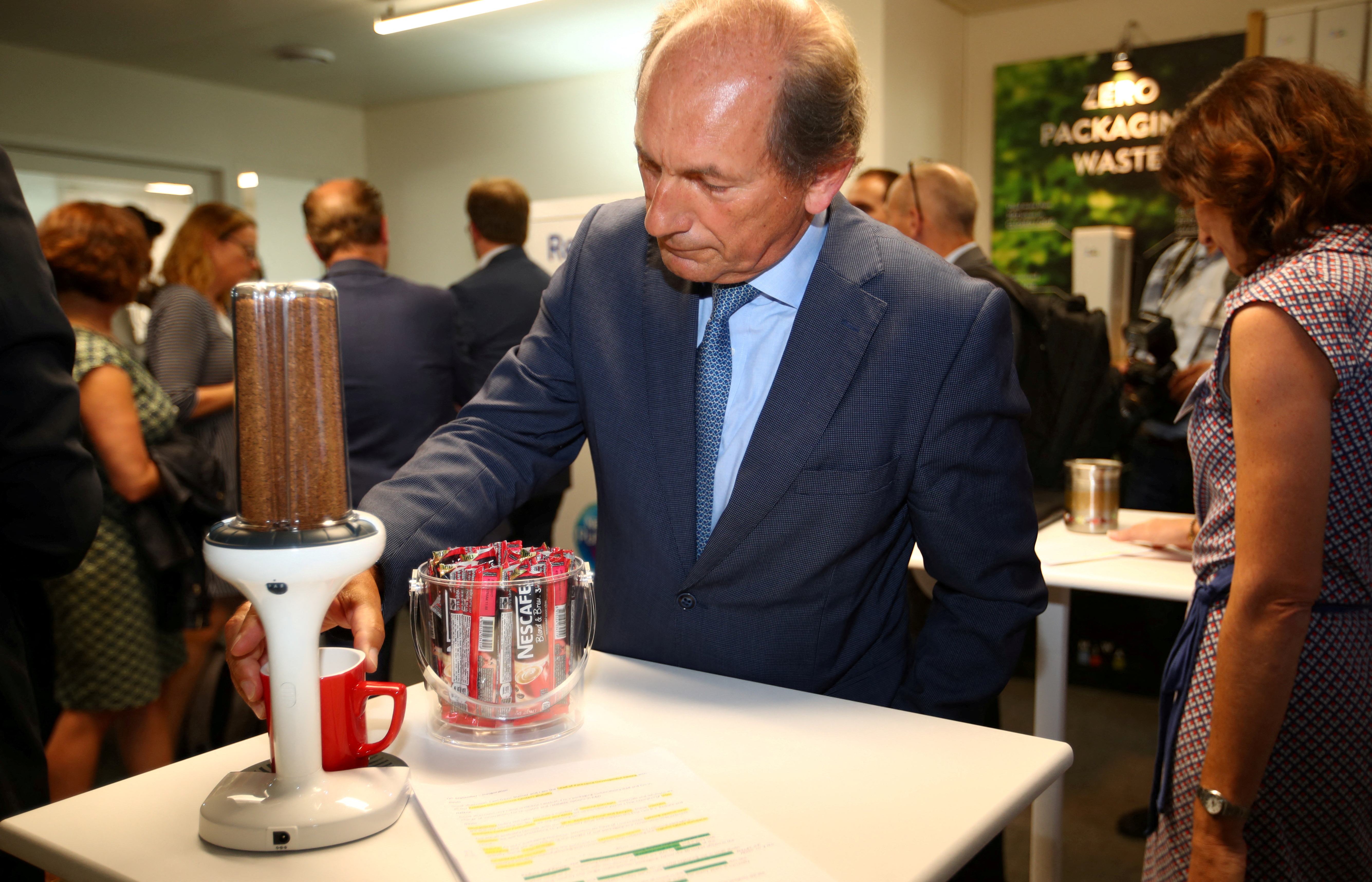 Swiss food giant Nestle Chairman Bulcke checks some Nescafe distribution device in Lausanne