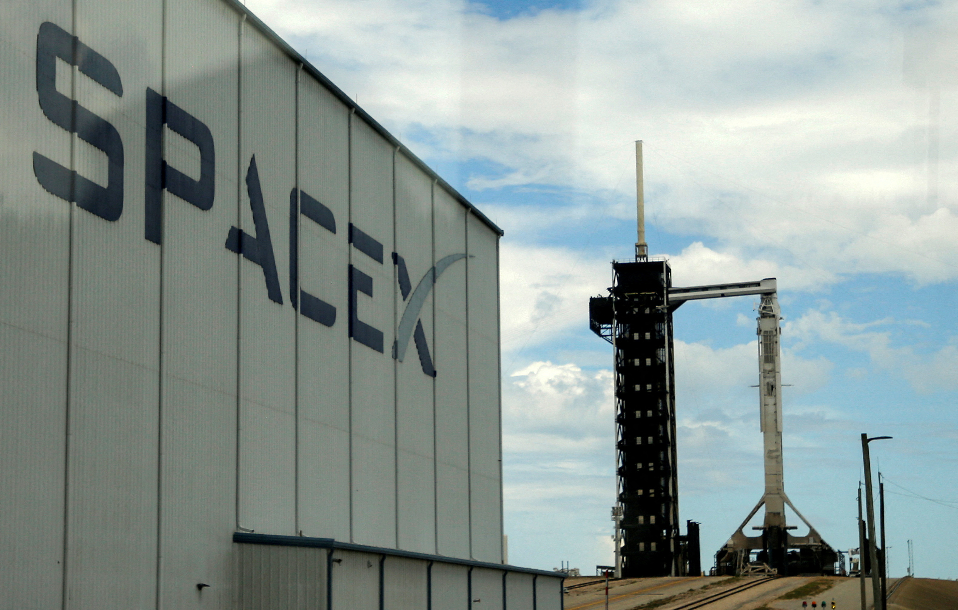 A SpaceX Falcon 9 rocket is prepared for launch of Polaris Dawn, a private human spaceflight mission, at the Kennedy Space Center in Cape Canaveral