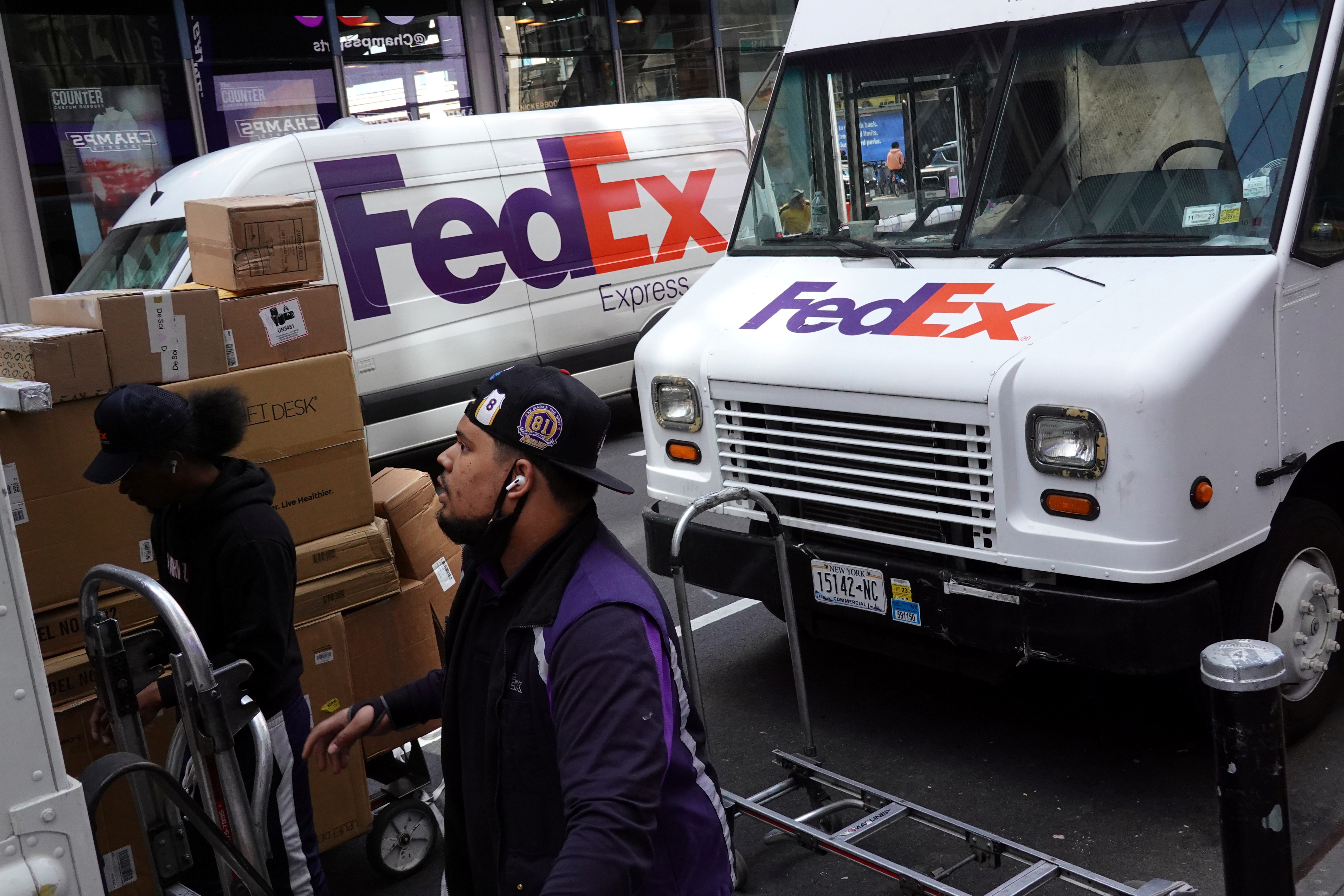 FedEx workers sort packages in Manhattan, New York City