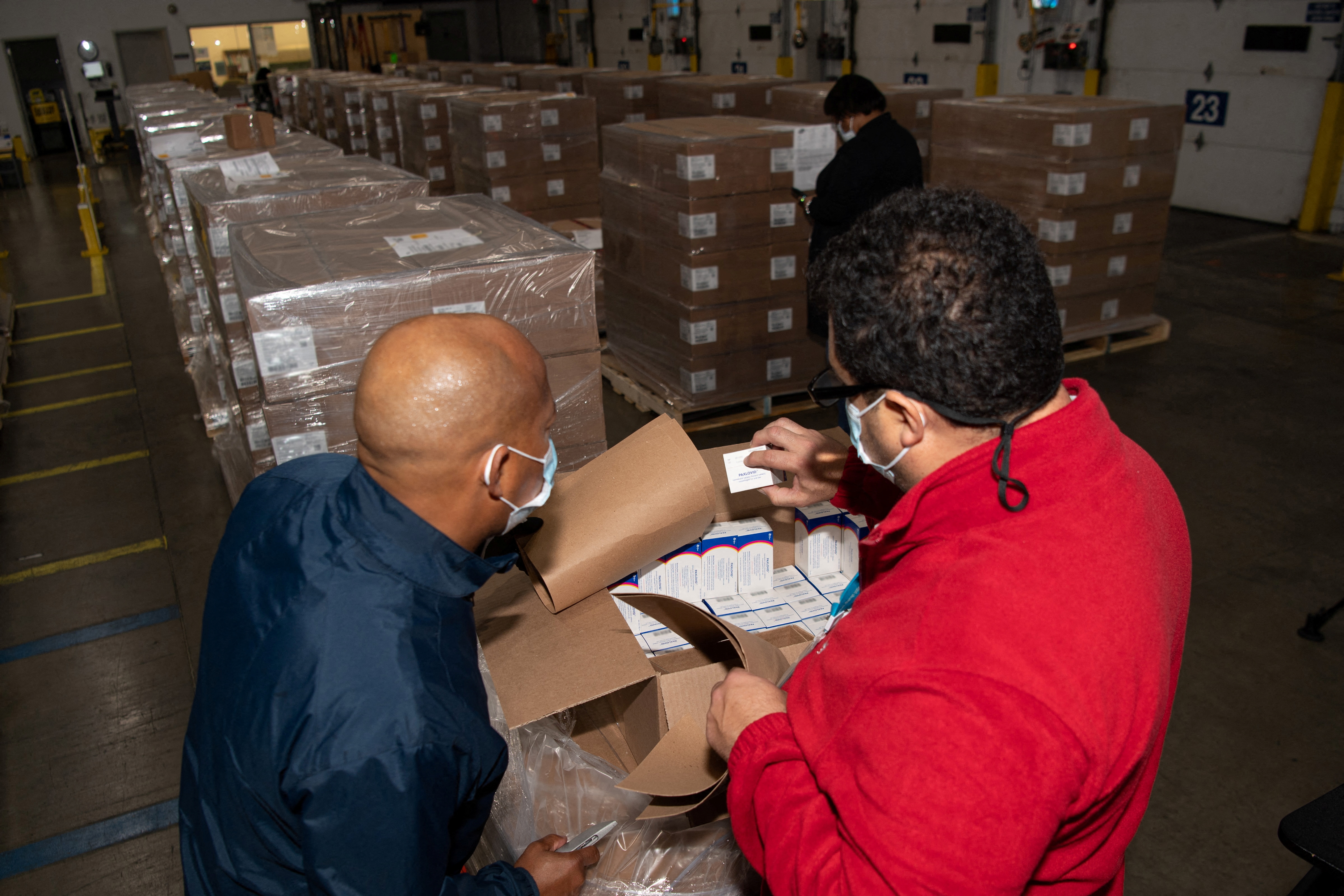 Pfizer employees check the boxes containing Paxlovid, COVID-19 treatment pills, at a distribution facility in Memphis, Tennessee, U.S. in this undated handout picture. Pfizer/Handout via REUTERS    