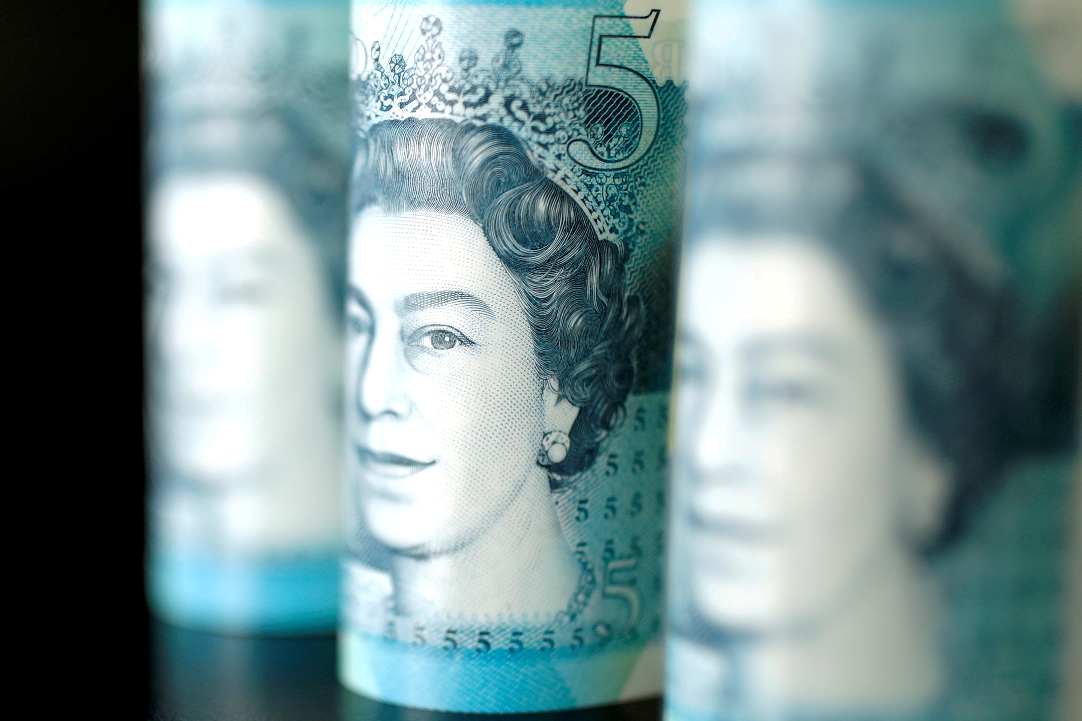 British five pound banknotes are seen in this picture illustration