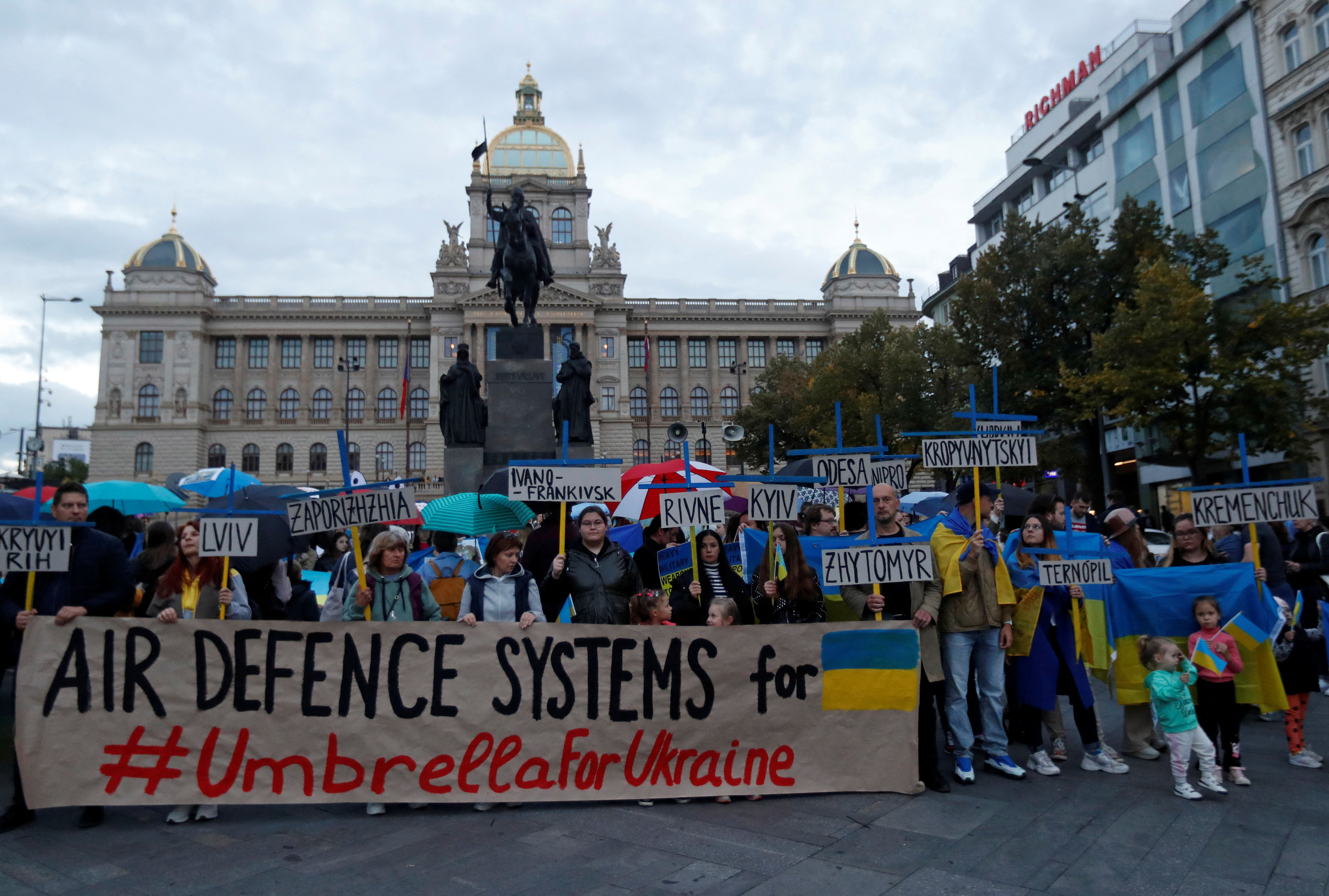 People hold a rally in support of Ukraine in Prague