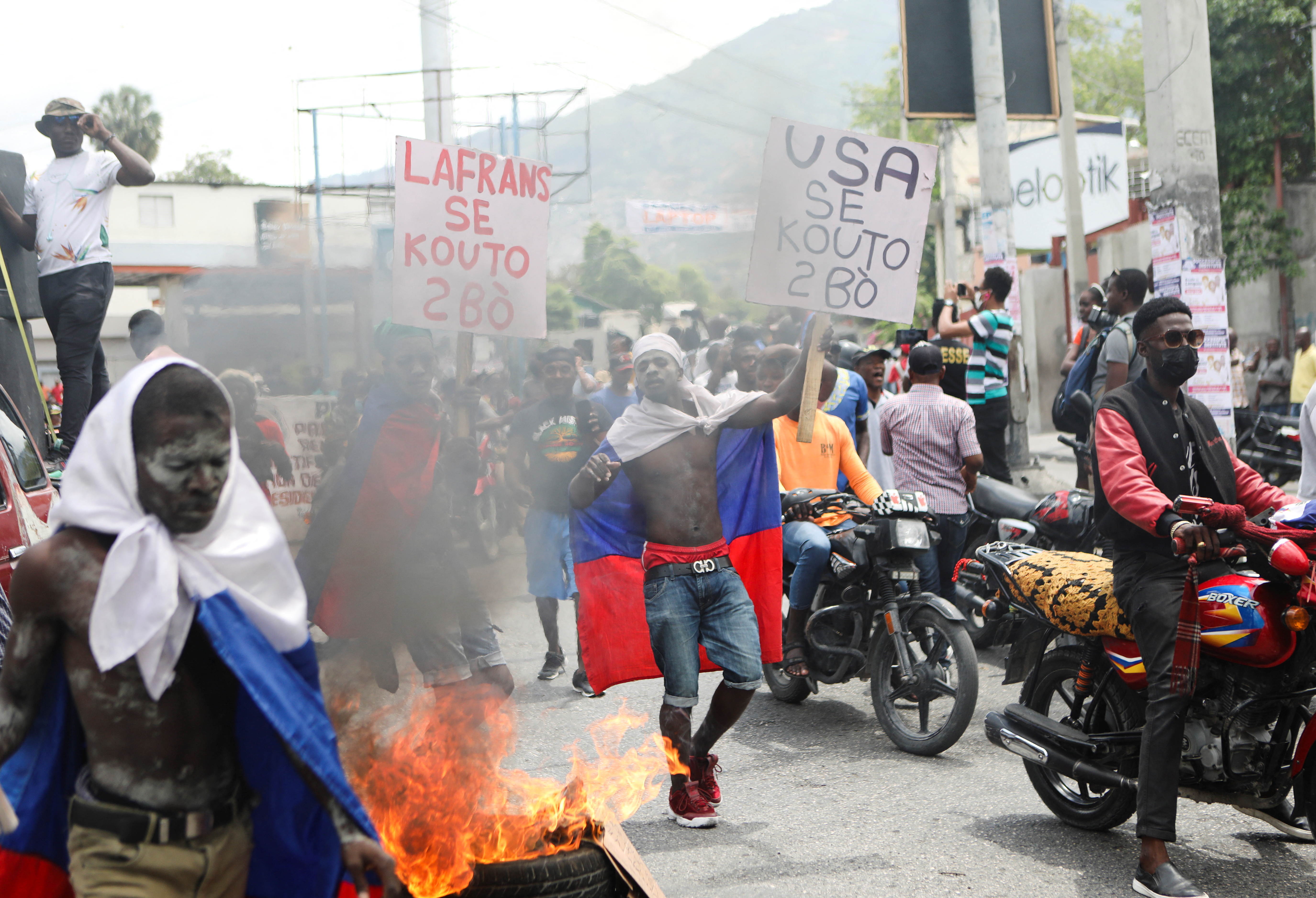 Demonstators march in protest against gang violence and kidnappings, in Port-au-Prince