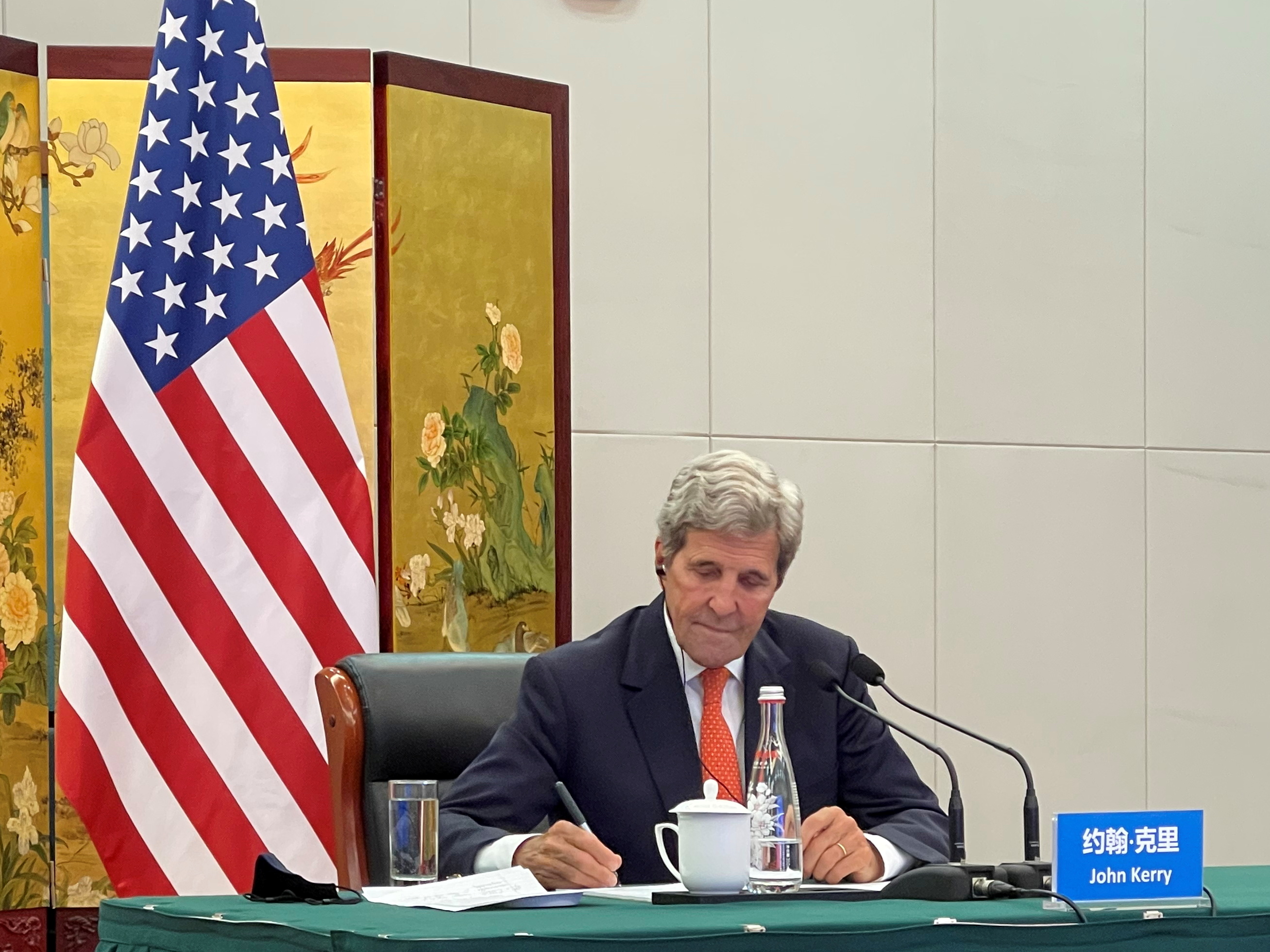 John Kerry attends a meeting via video link with Wang Yi from Tianjin