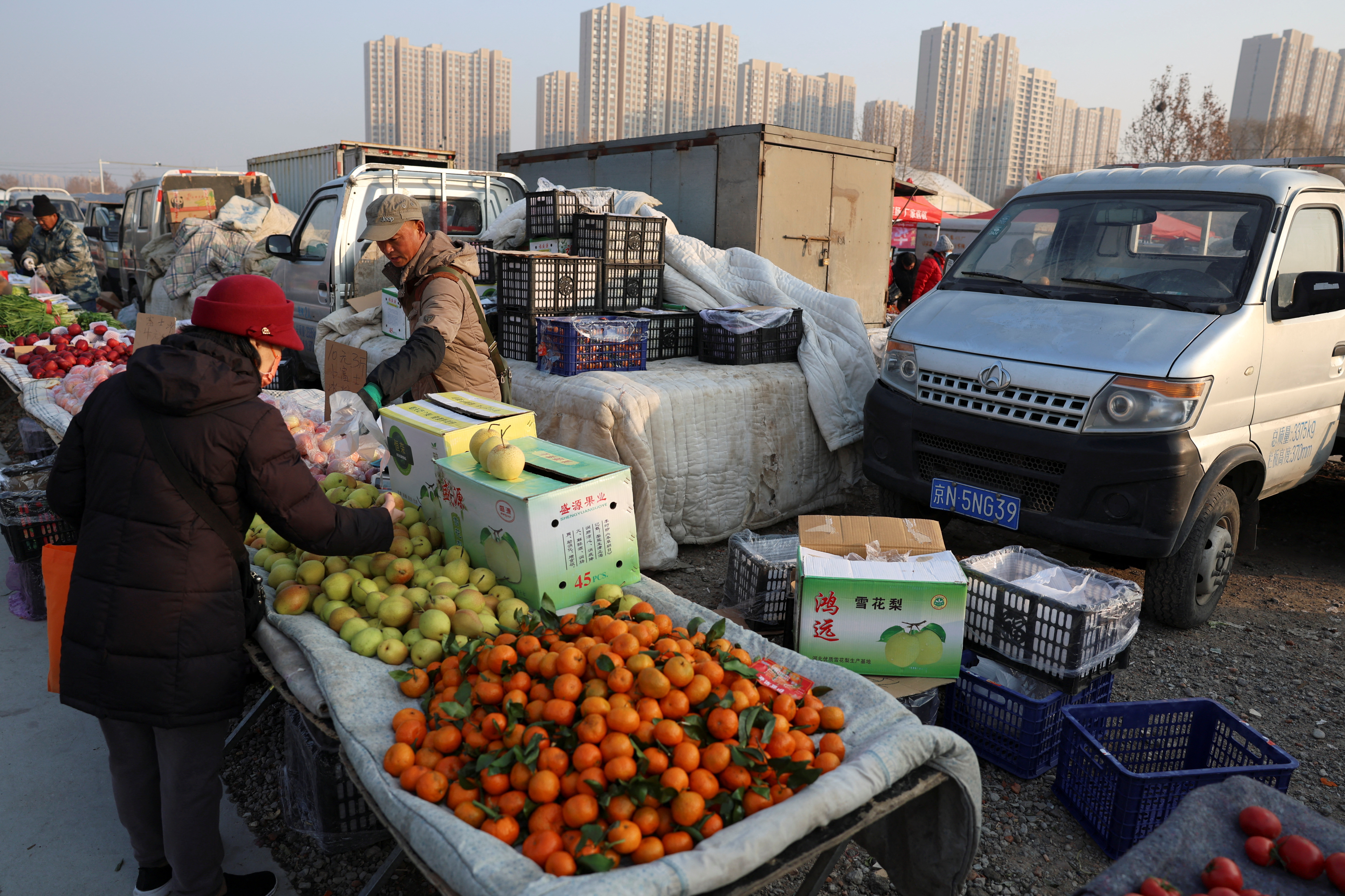 Vegetable vendor at market in Beijing