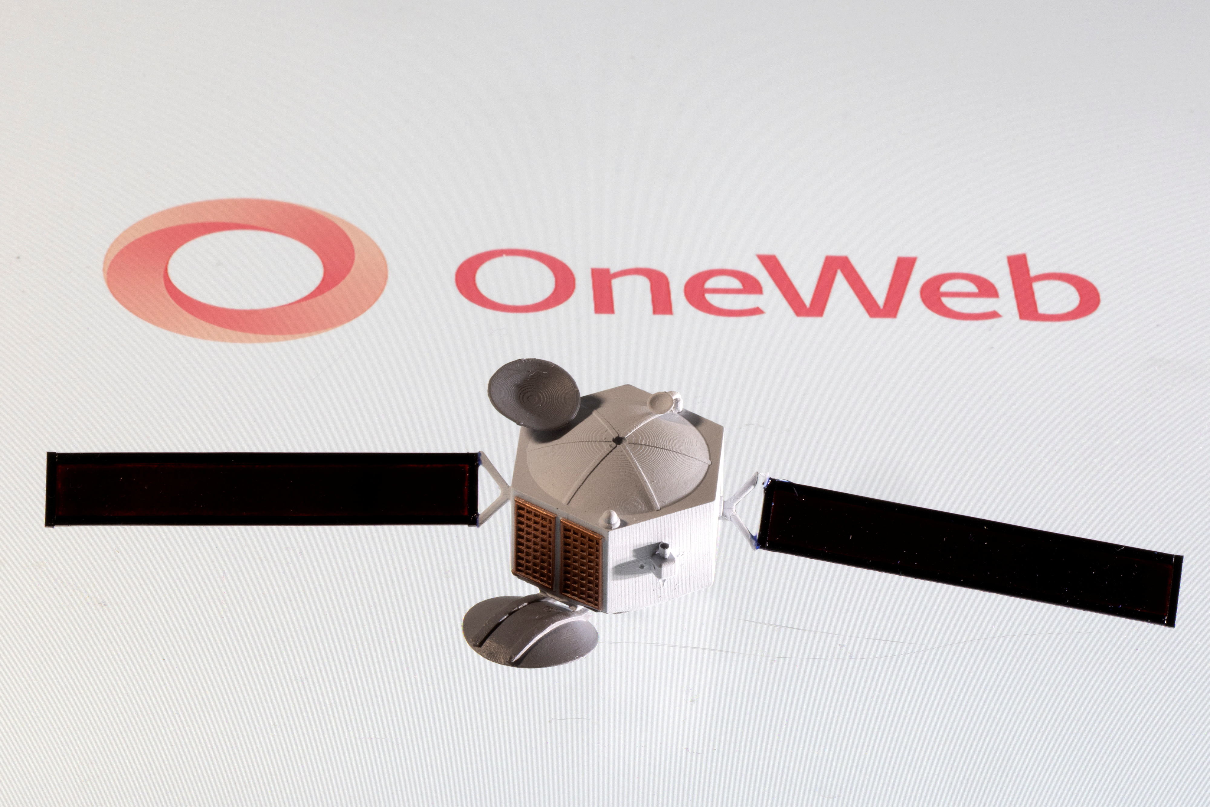 Illustration shows OneWeb logo and satellite model