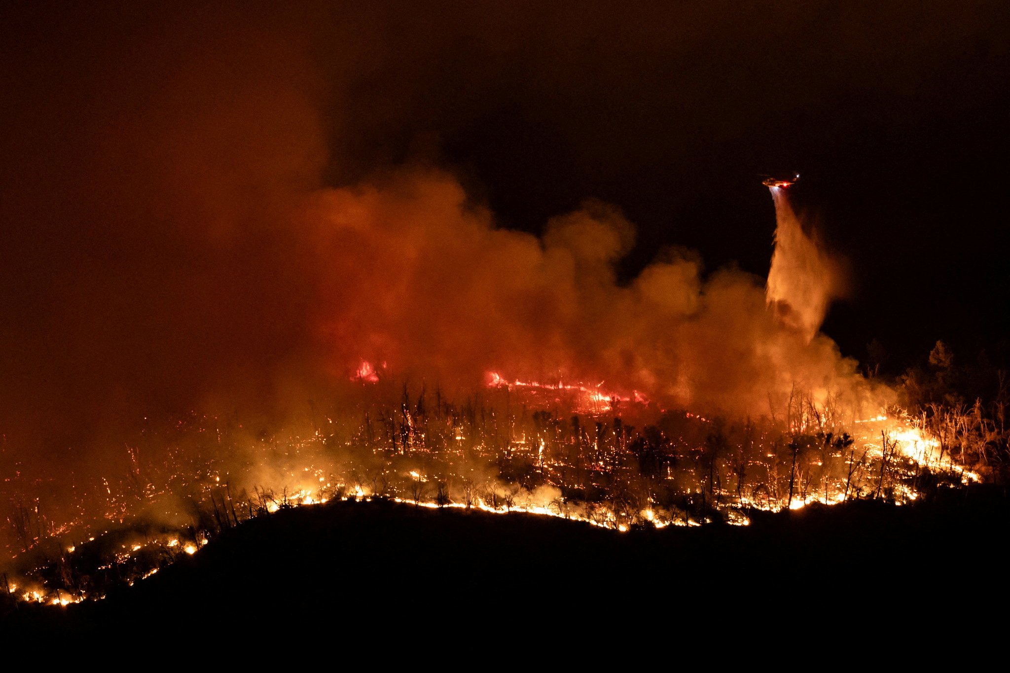 In pictures: Thompson wildfire forces thousands to evacuate in ...