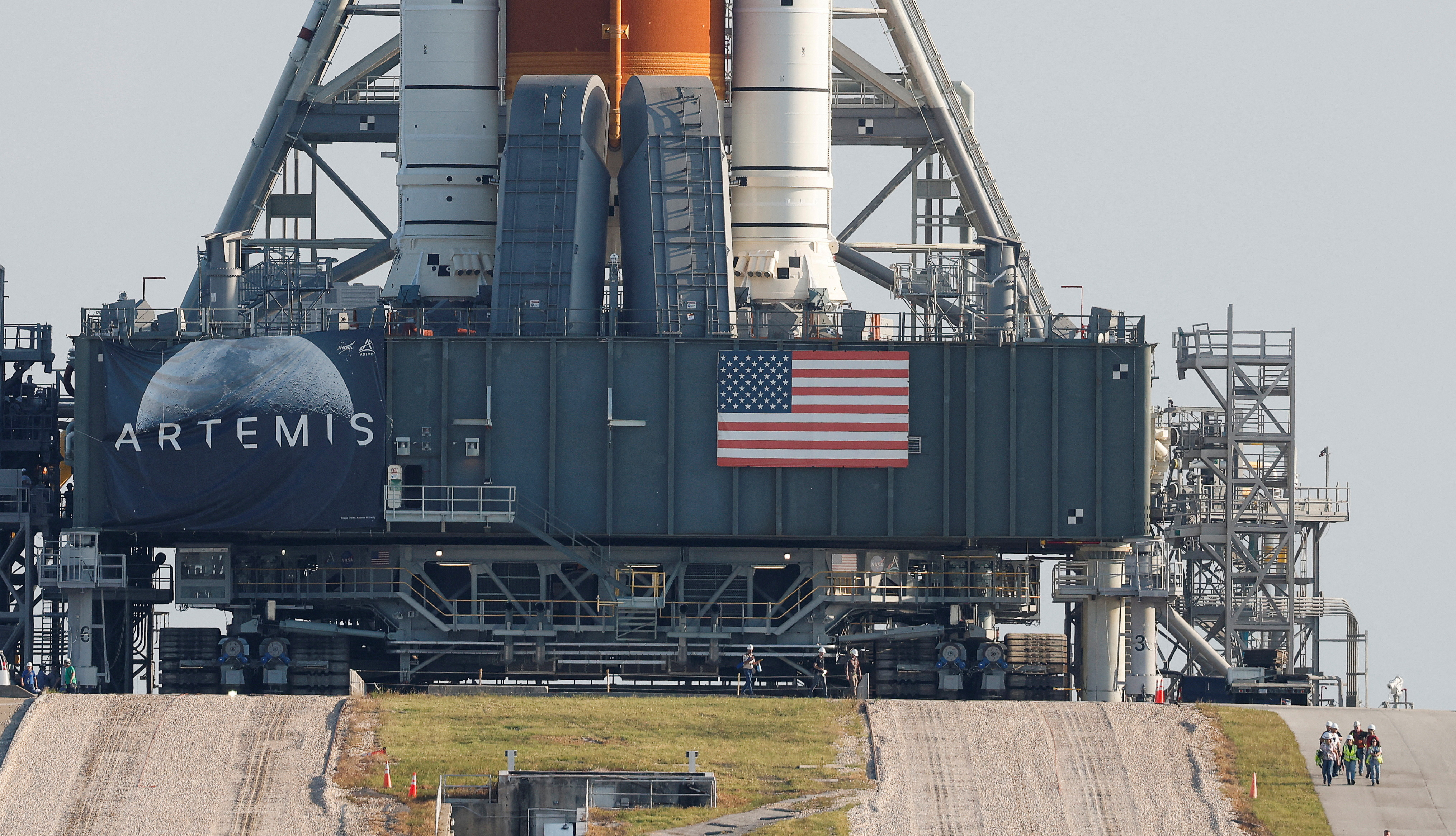 NASA's next-generation moon rocket, the SSLS Artemis 1 rocket with its Orion crew capsule perched on top, leaves the Vehicle Assembly Building