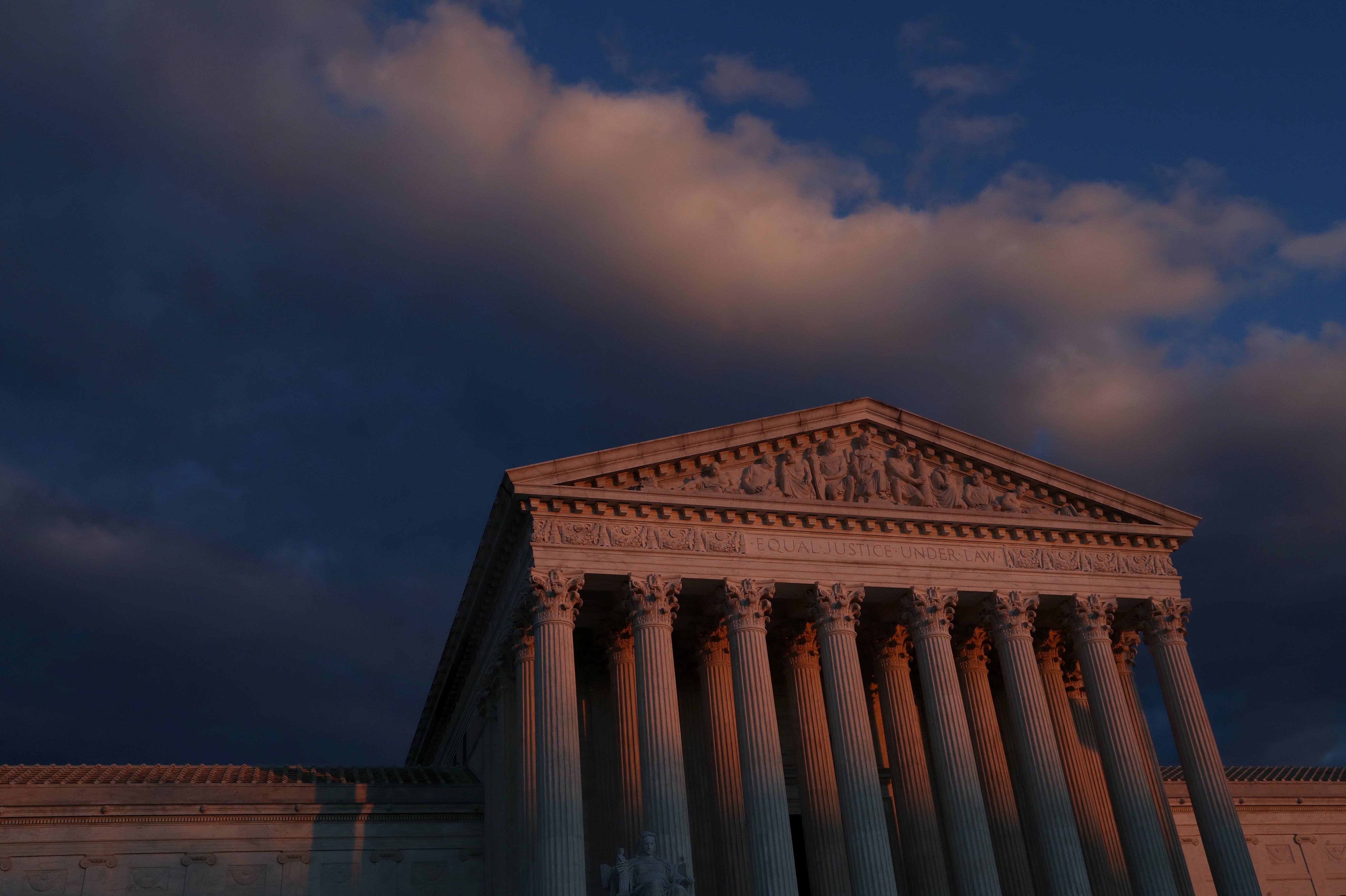 The sun sets at the U.S. Supreme Court building, November 29, 2021. REUTERS/Leah Millis