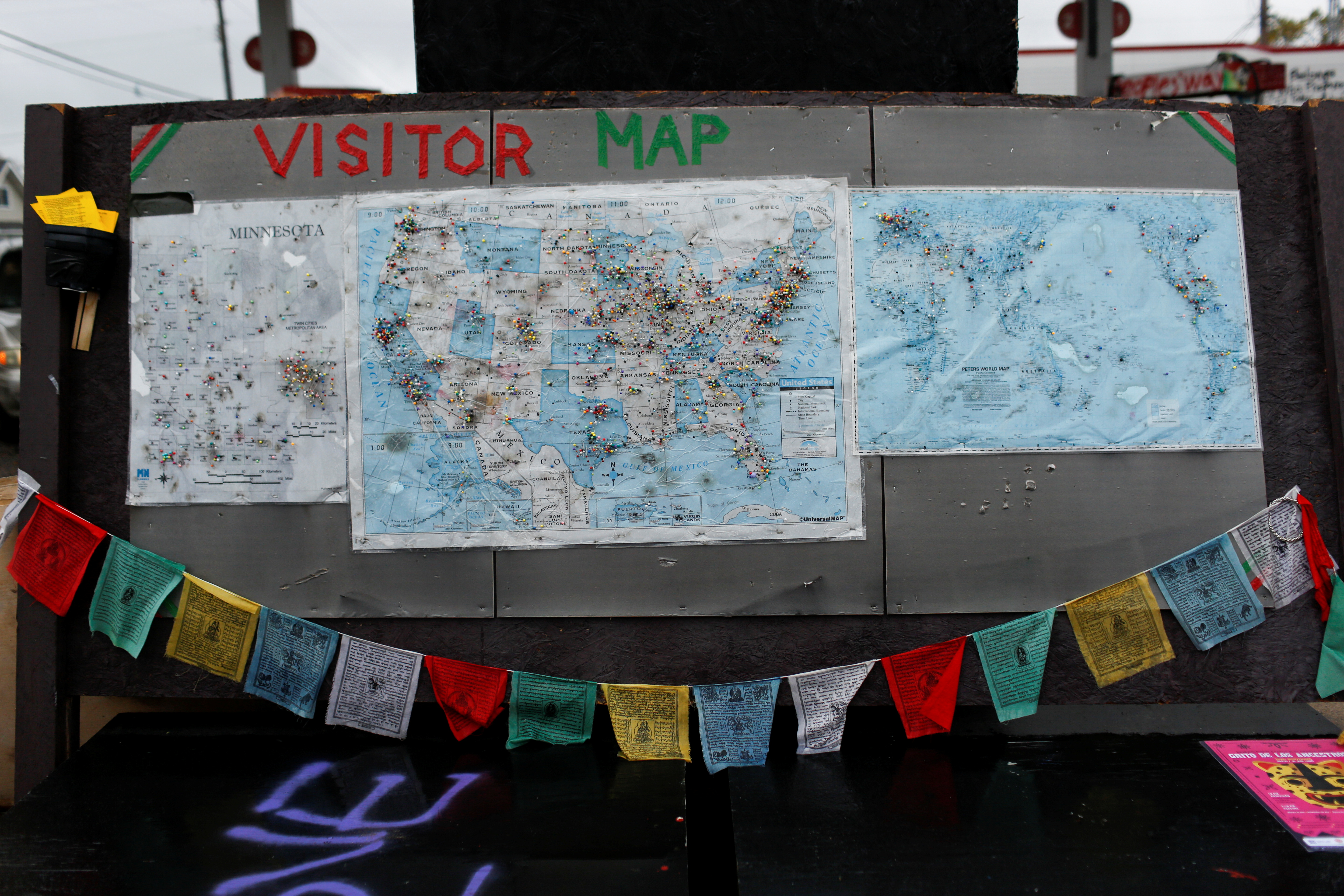 Maps of Minnesota, the country, and the world are filled with pins from visitors at George Floyd Square in Minneapolis, Minnesota, U.S., October 28, 2021. Picture taken October 28, 2021.  REUTERS/Nicole Neri