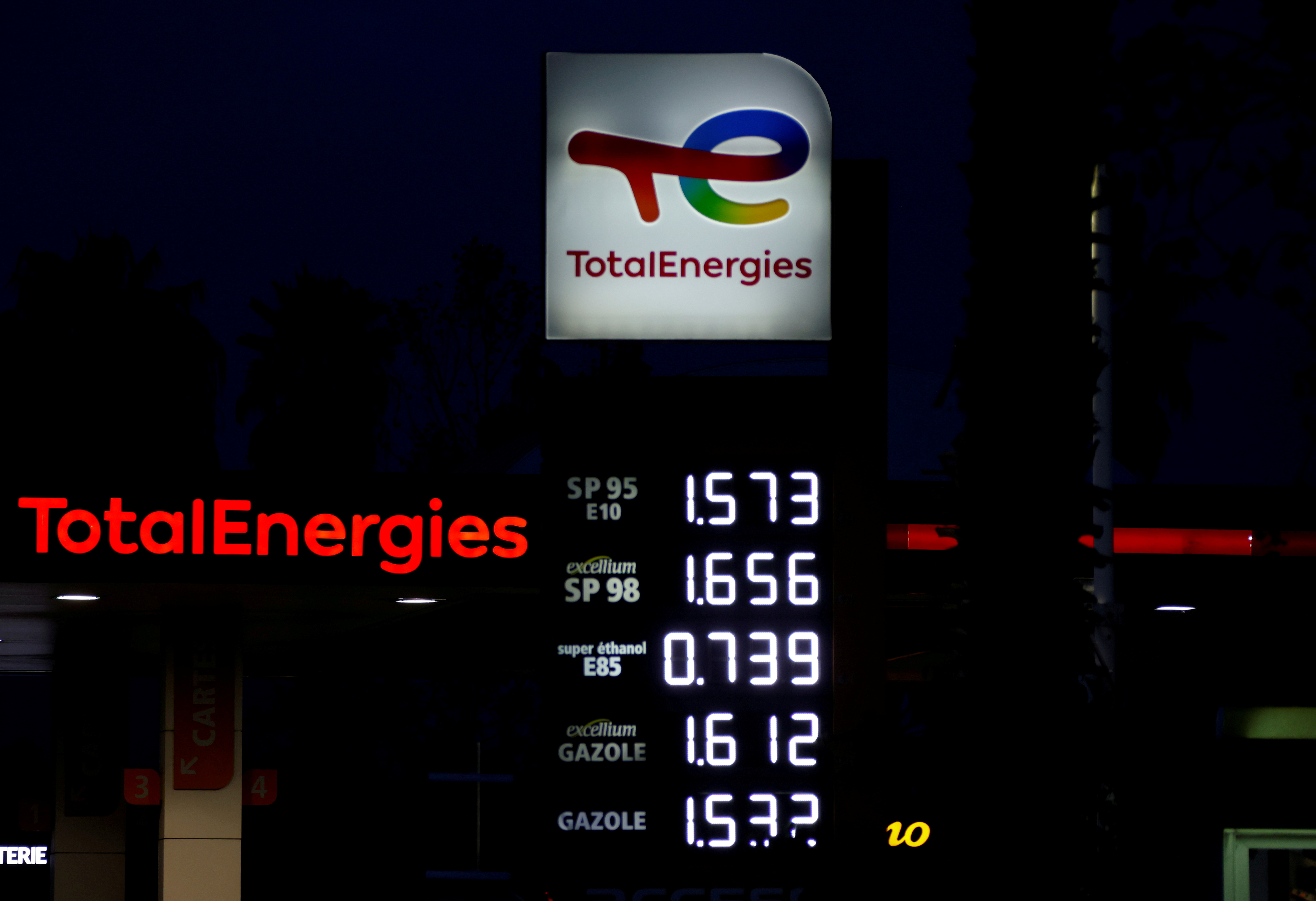 Fuel price signs are seen at a TotalEnergie petrol station in Nice, France, October 13, 2021. REUTERS/Eric Gaillard/File Photo
