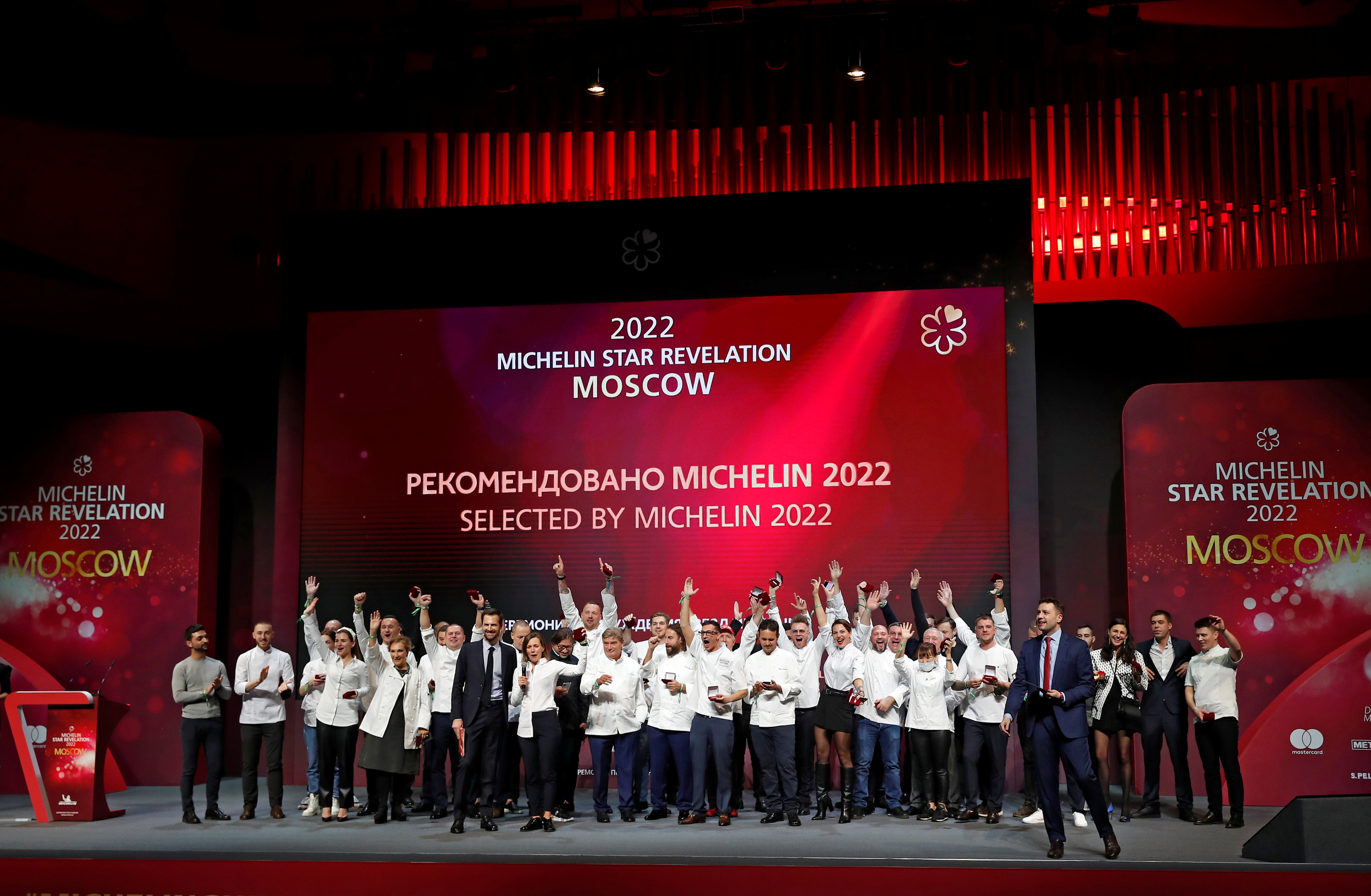 Chefs celebrate on stage during the Michelin Guide 2022 award ceremony in Moscow, Russia October 14, 2021. REUTERS/Maxim Shemetov