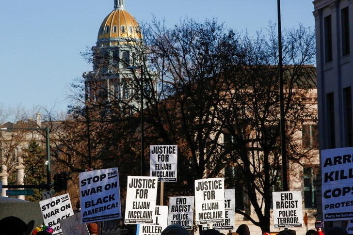 Protesters gather for a rally to call for justice for Elijah McClain in Denver