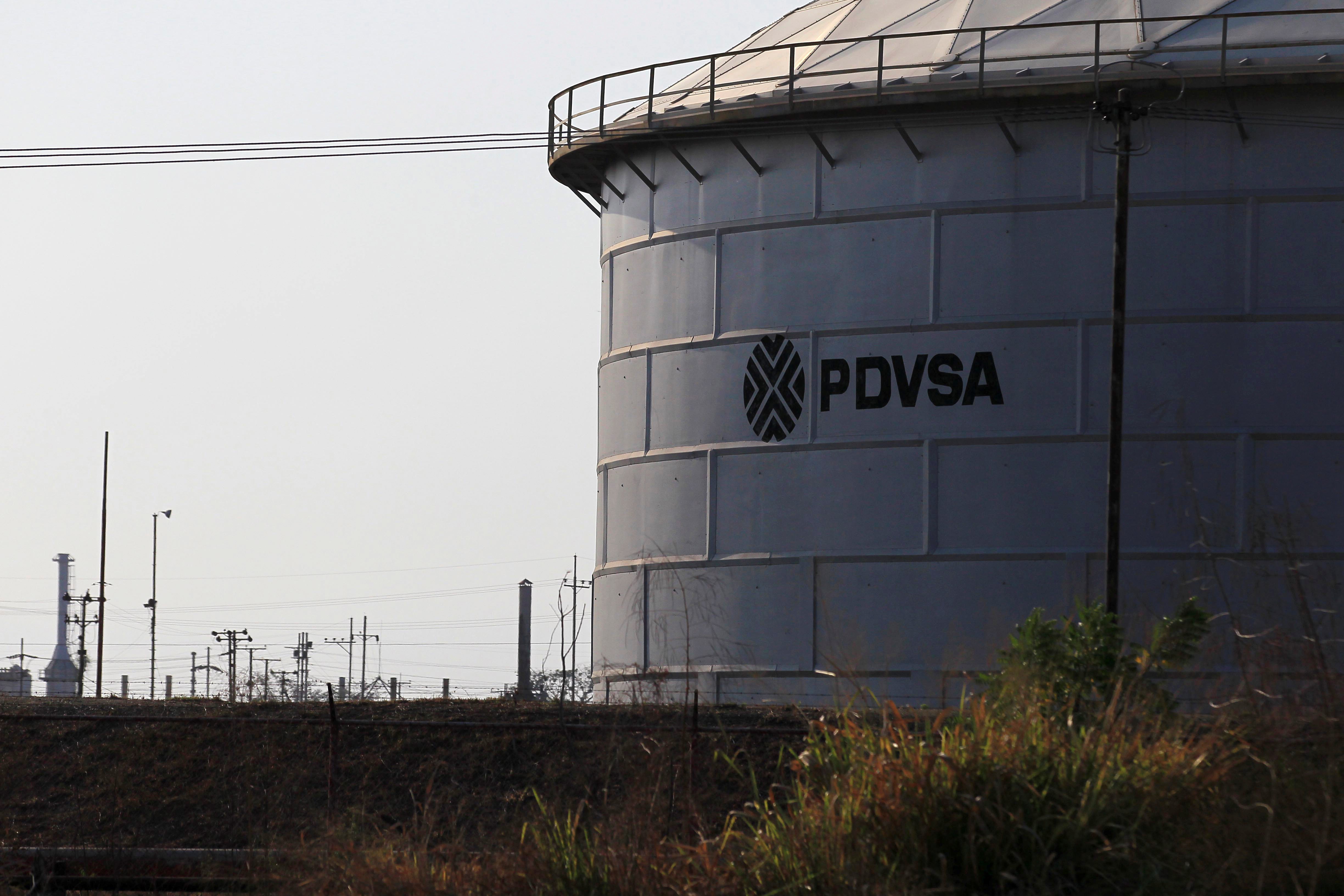 The corporate logo of state oil company PDVSA is seen on a tank at an oil facility in Lagunillas