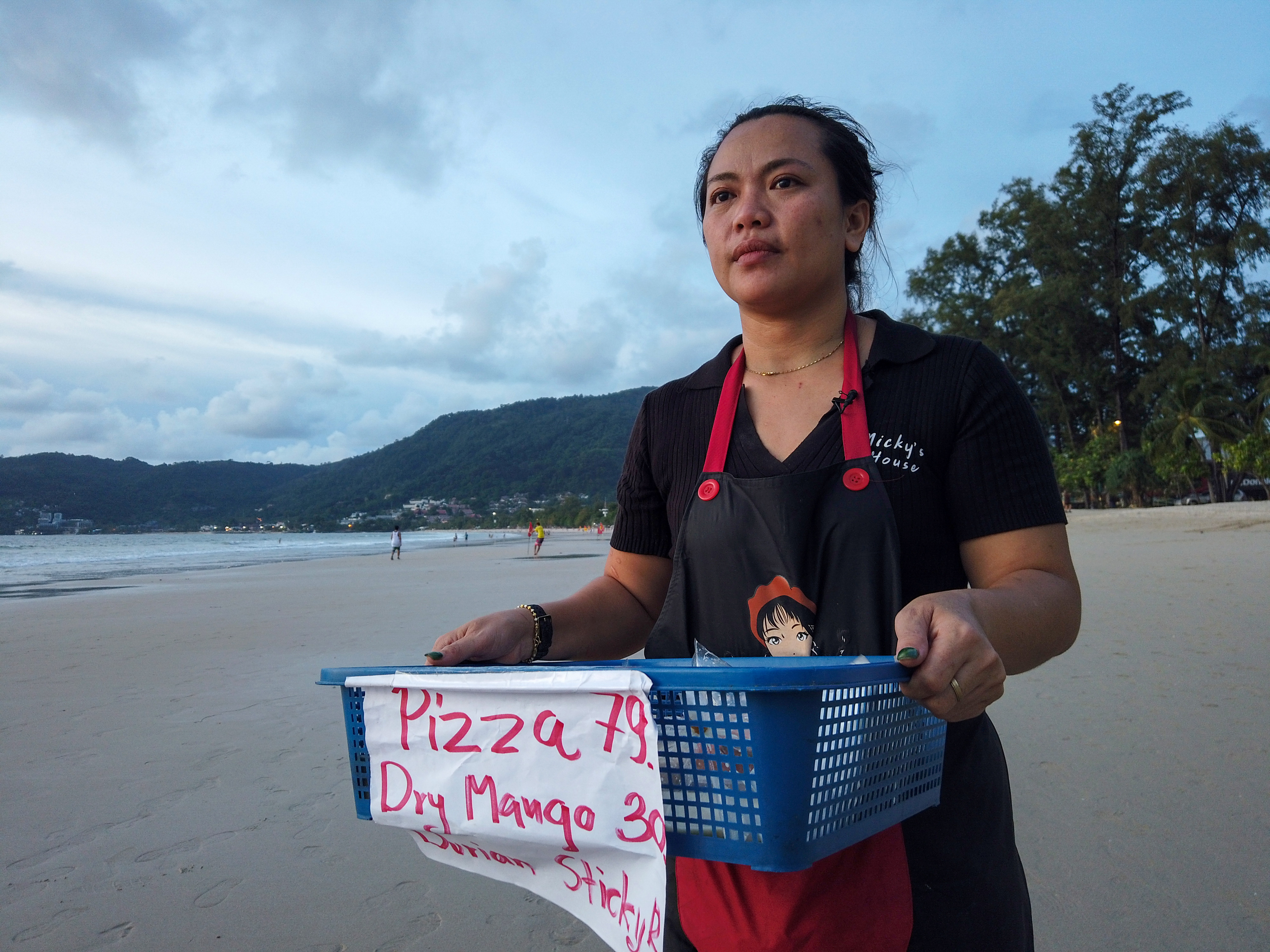 Pimonta sells food on the beach while waiting for the reopening of Phuket