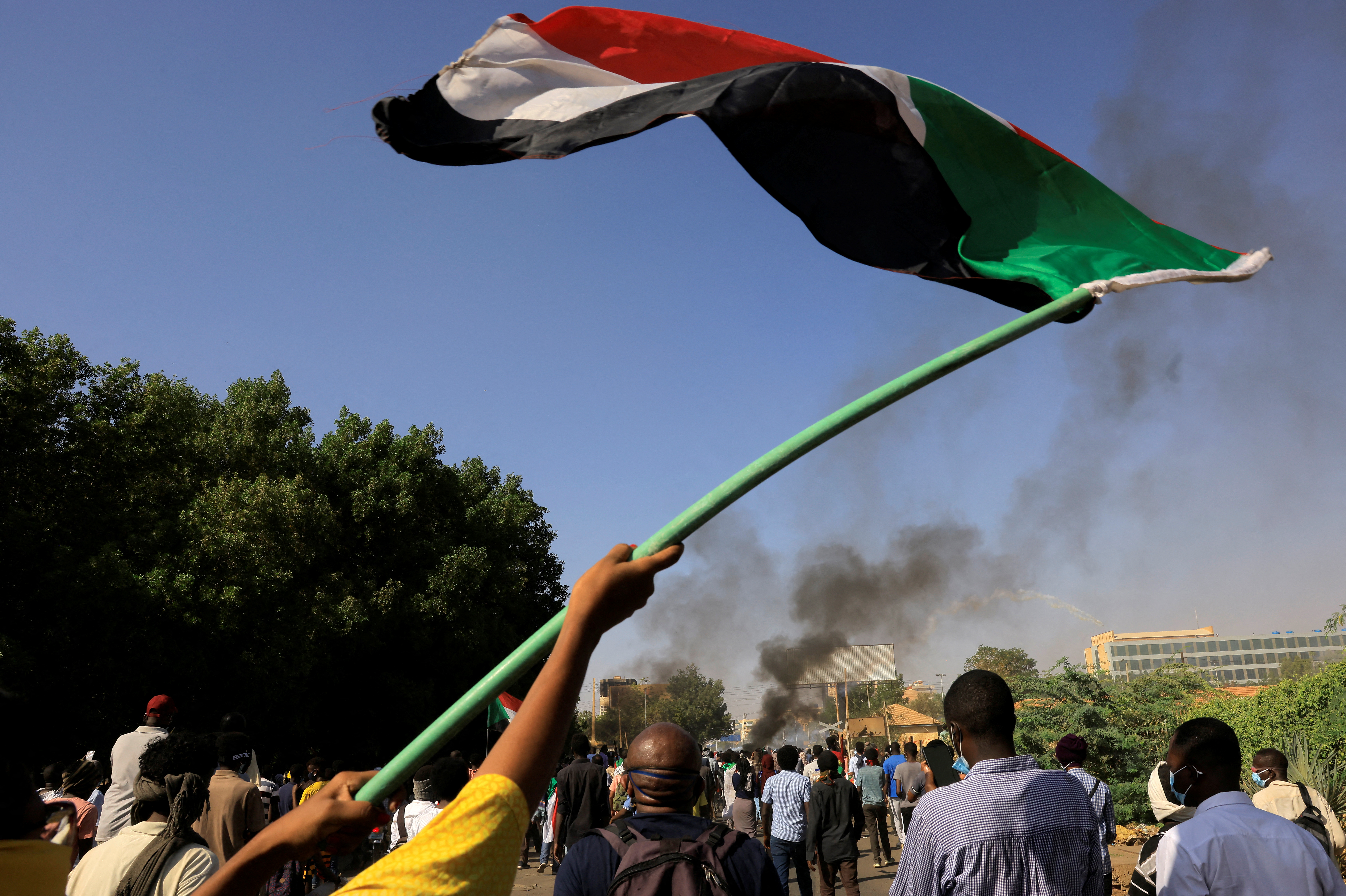 Protesters march during a rally against the military rule following last month's coup, in Khartoum