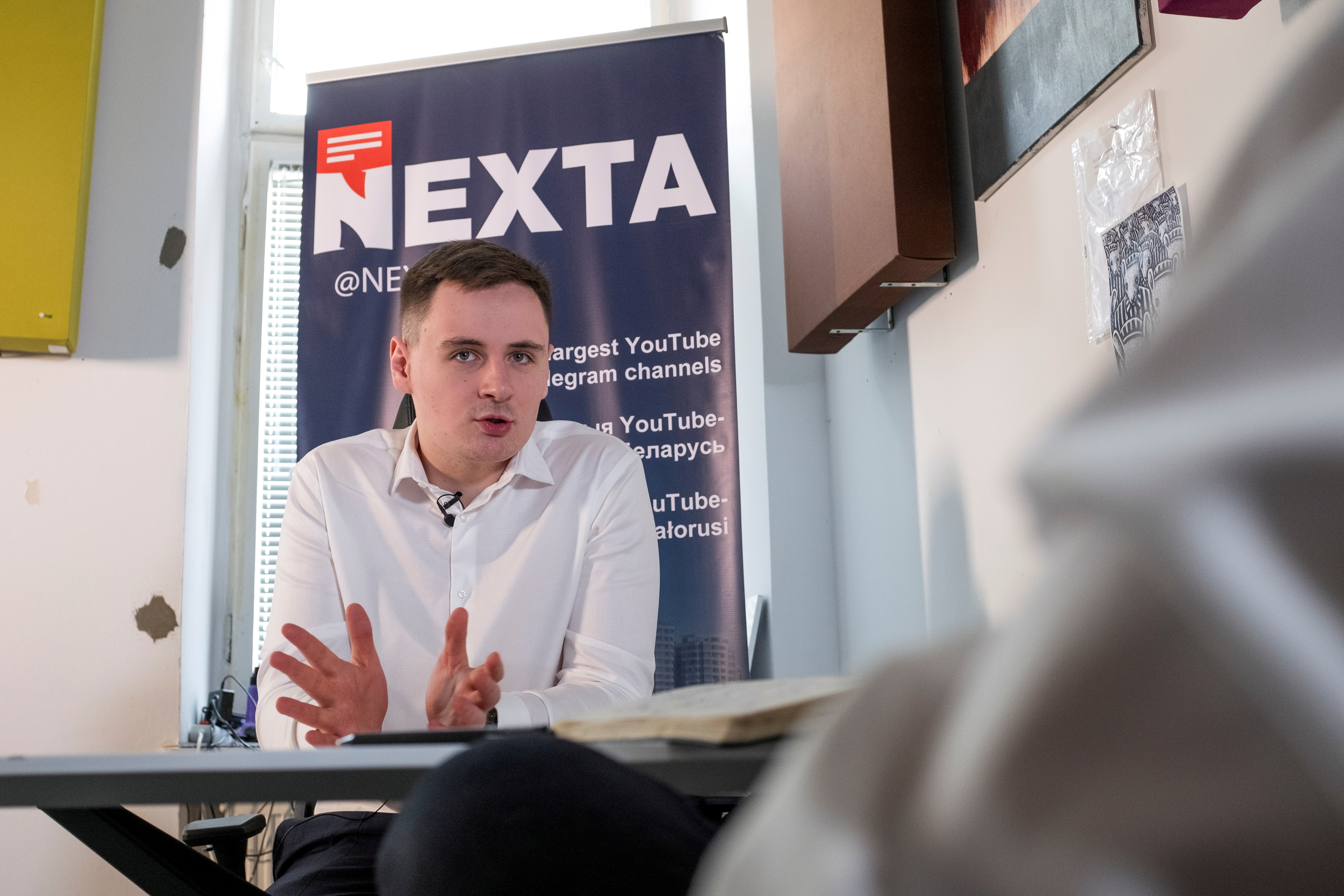 Warsaw-based Belarusian blogger Stsiapan Putsila speaks during an interview at NEXTA office in Warsaw