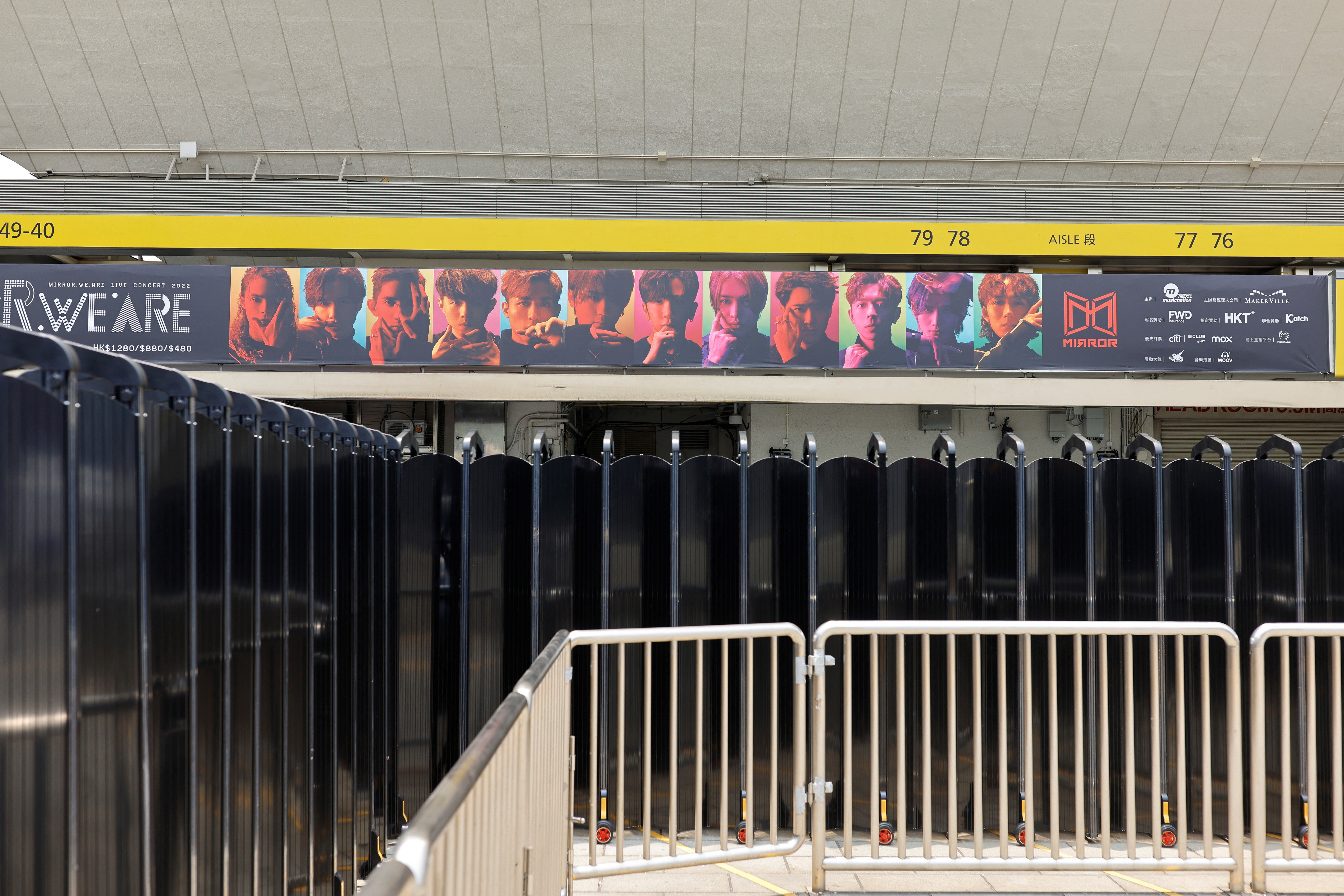 Barriers are seen outside Hong Kong Coliseum after giant video panel fell onto the stage during a concert by Hong Kong boyband Mirror, in Hong Kong