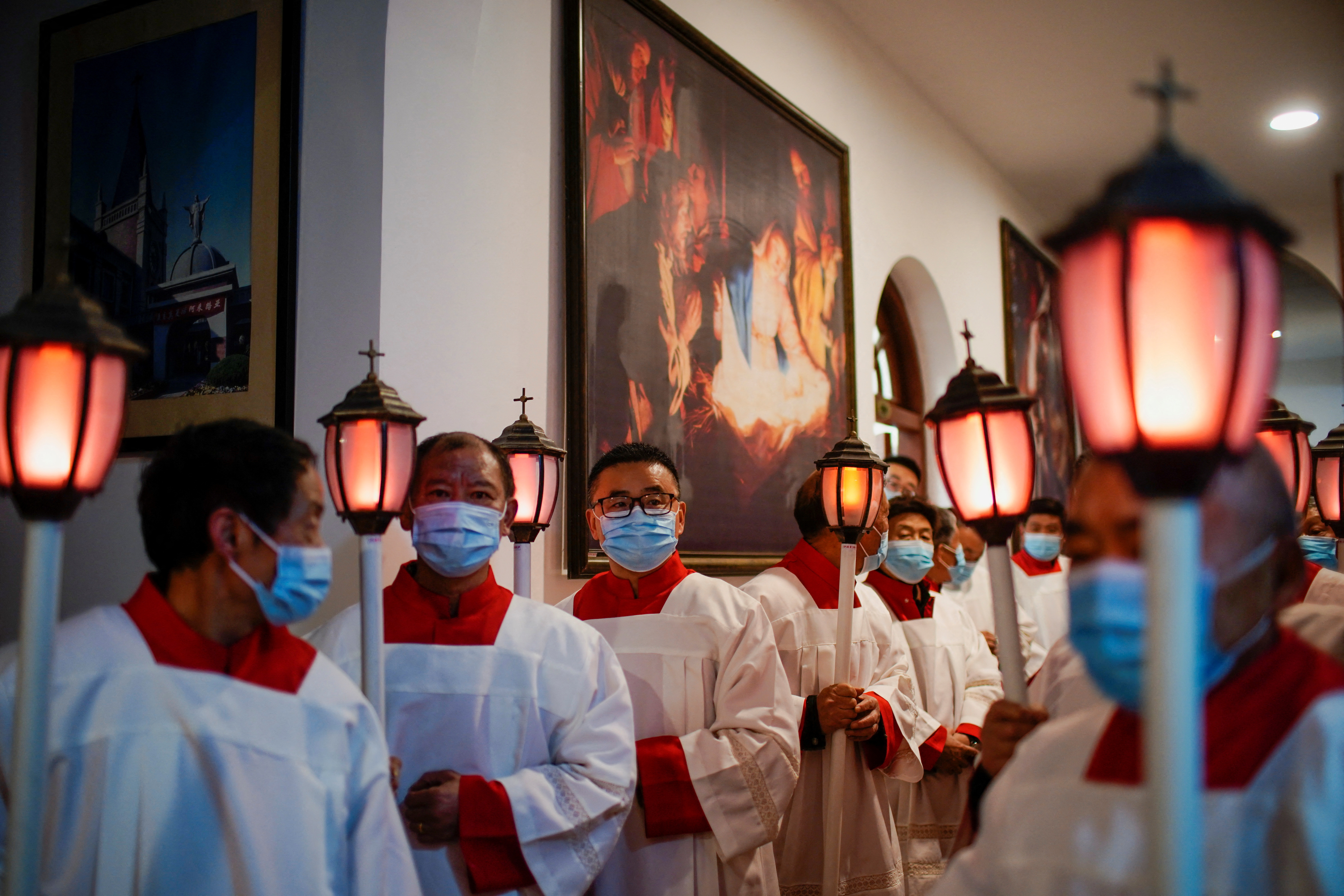 Chinese Catholics attend an Easter Vigil service, at a Catholic church in Shanghai
