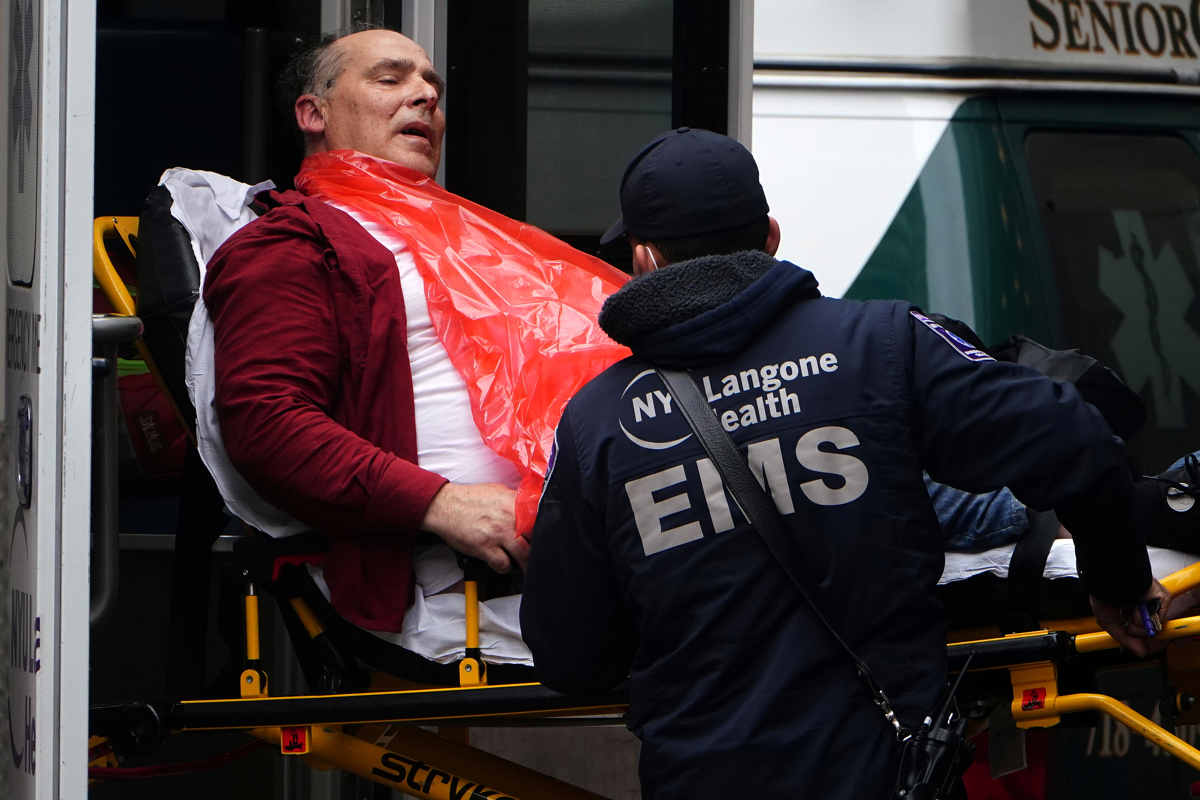 A man is brought to hospital on a stretcher in New York