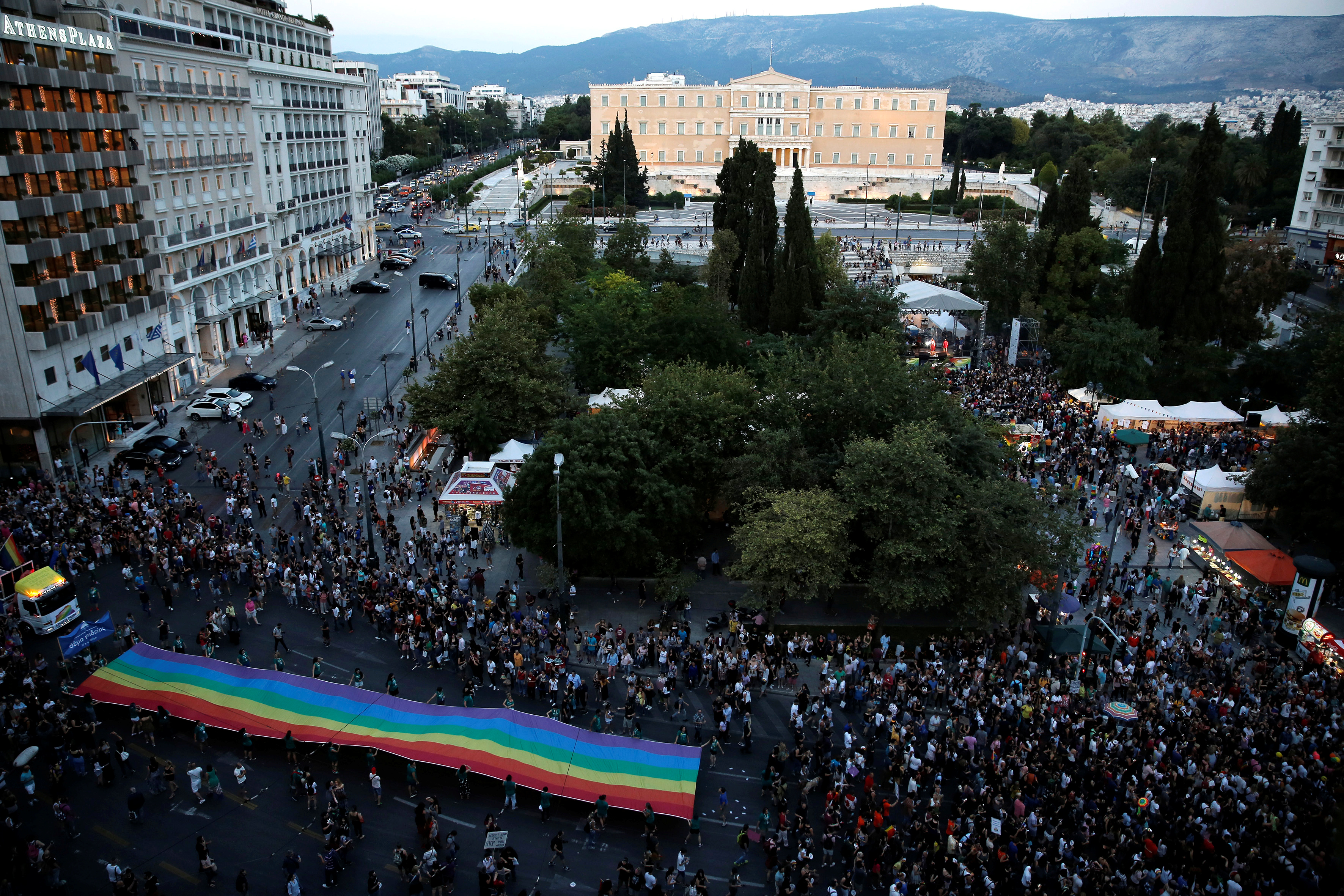 A huge rainbow flag is seen in front of the parliament building during a gay pride parade in Athens