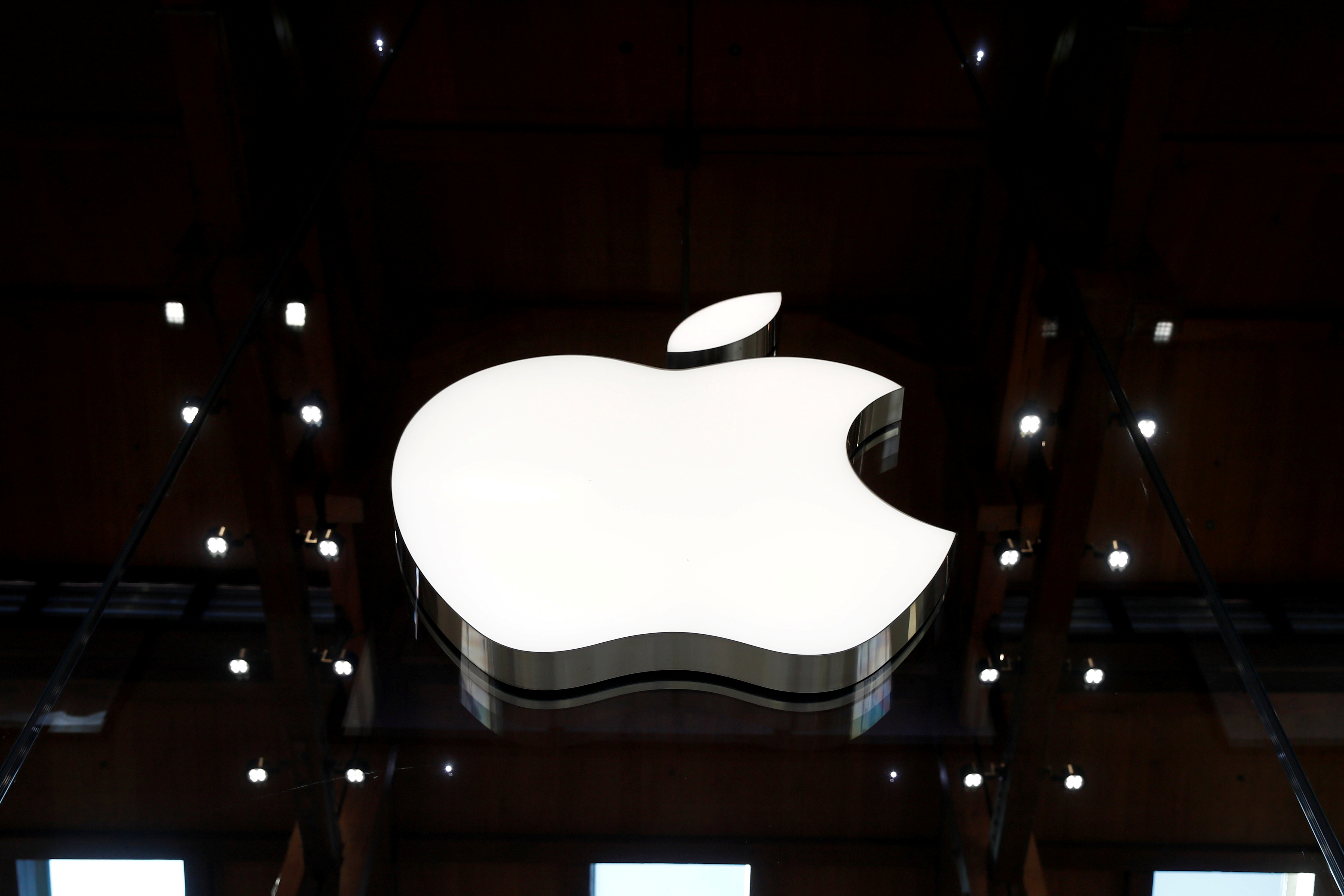 An Apple logo is pictured in an Apple store in Paris, France September 17, 2021. REUTERS/Gonzalo Fuentes/File Photo