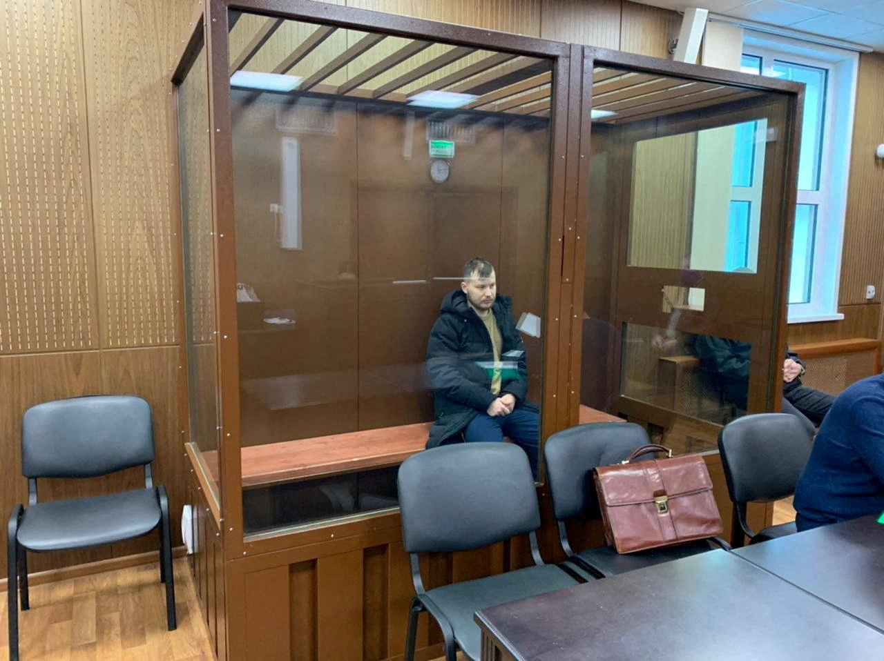 Ruslan Khansvyarov, detained on suspicion of the illegal circulation of means of payment, attends a court hearing in Moscow