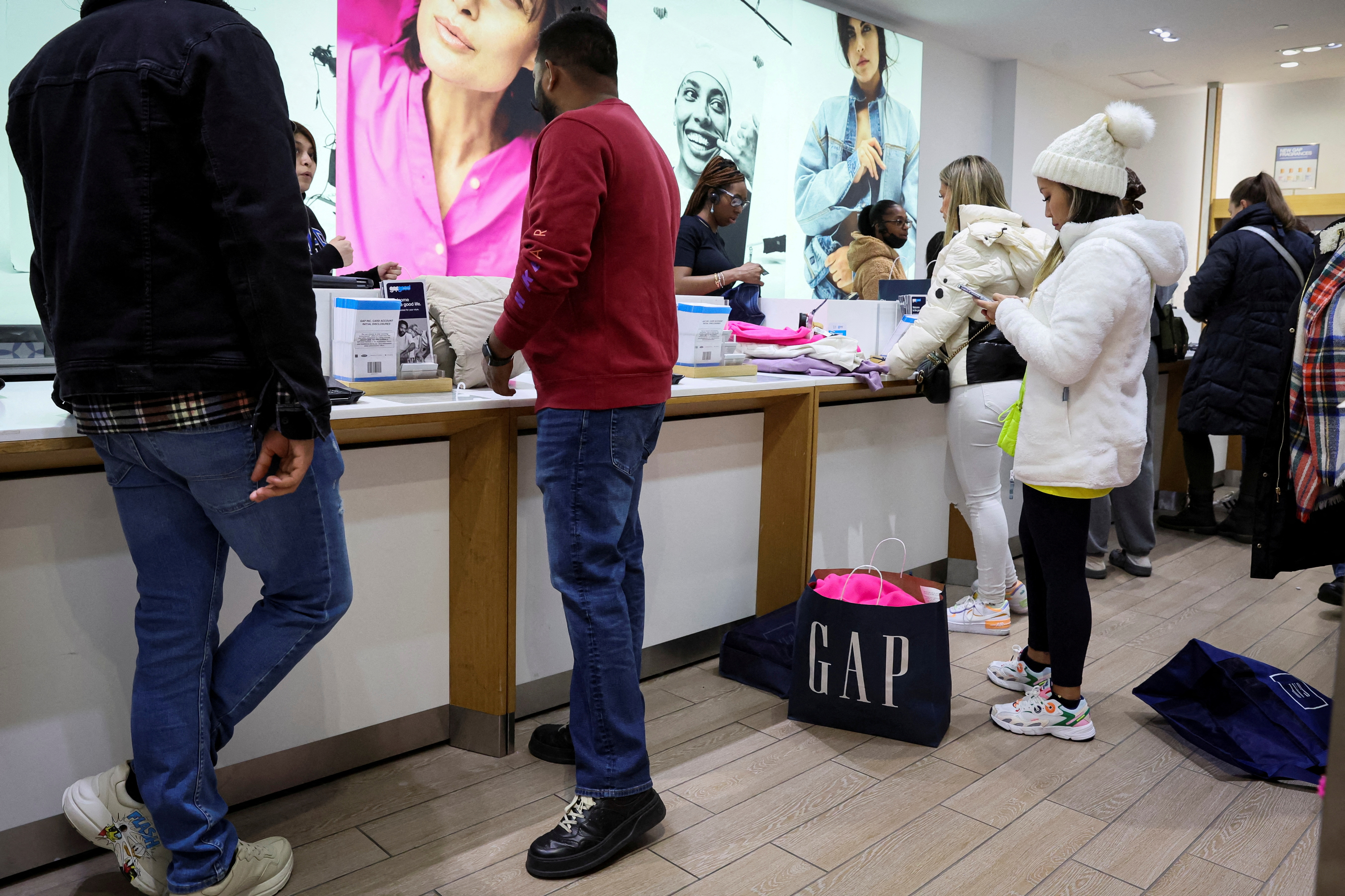 Shoppers look for early Black Friday sales at a Gap Store in Times Square on the Thanksgiving holiday in New York