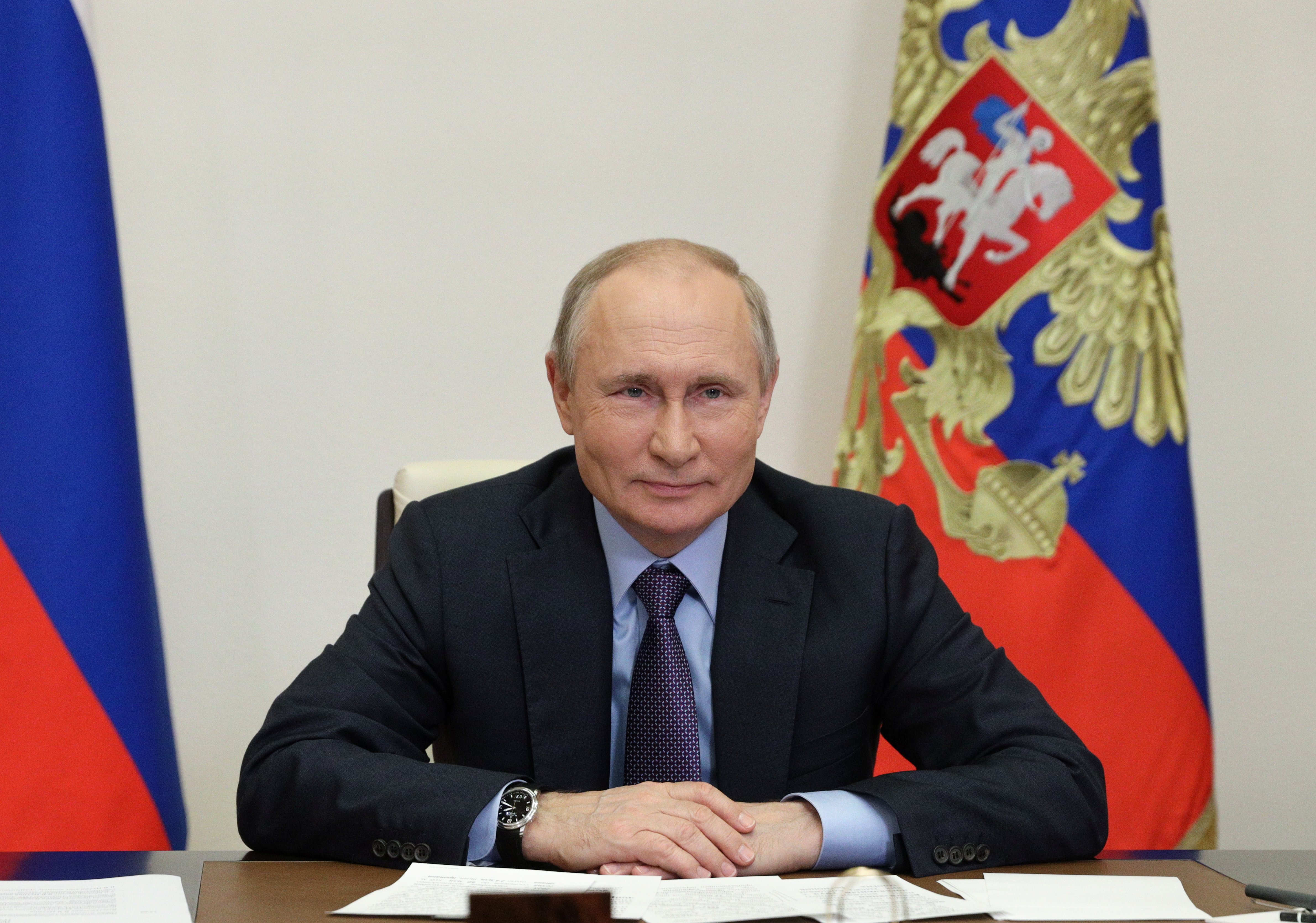 Russian President Putin takes part in a ceremony launching the Amur gas processing plant via video link outside Moscow