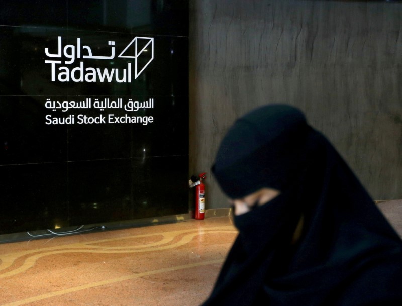 Saudi woman walks at the Saudi stock market (Tadawul), in Riyadh
