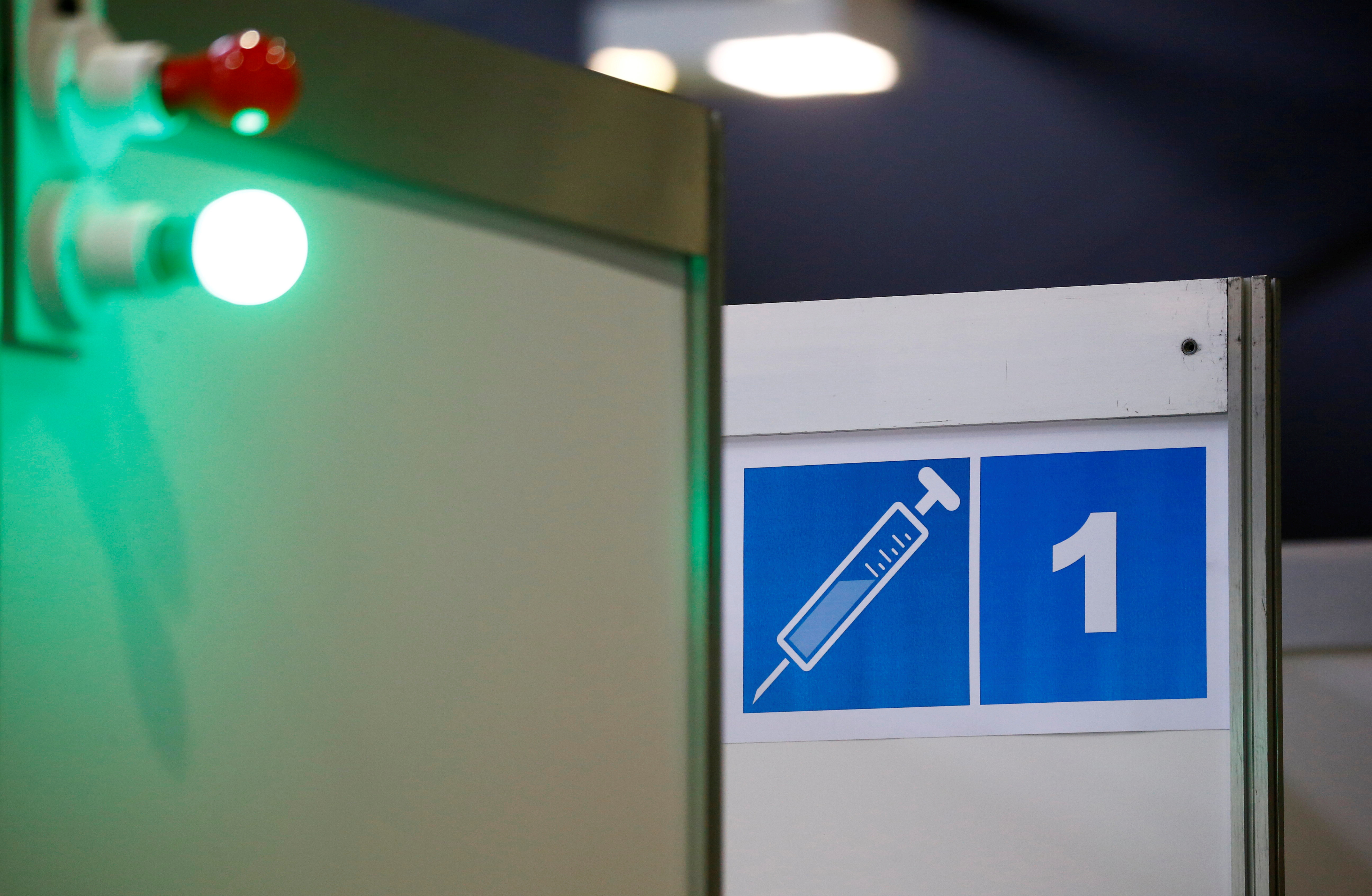 A green light is seen in front of a cabin for vaccinations at the vaccination center in Luzern