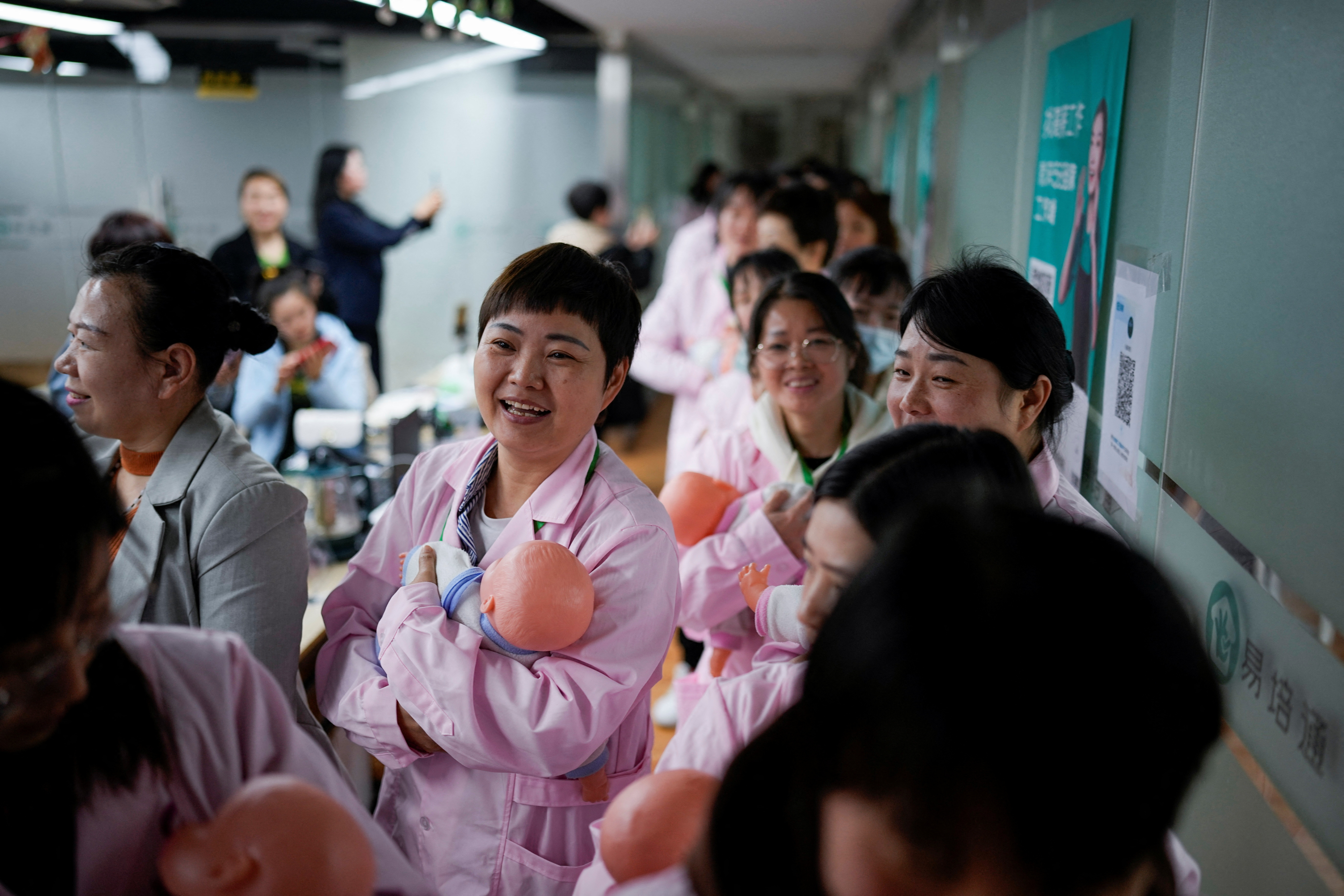 Need a nanny? Chinese school trains women to take care of newborns | Reuters