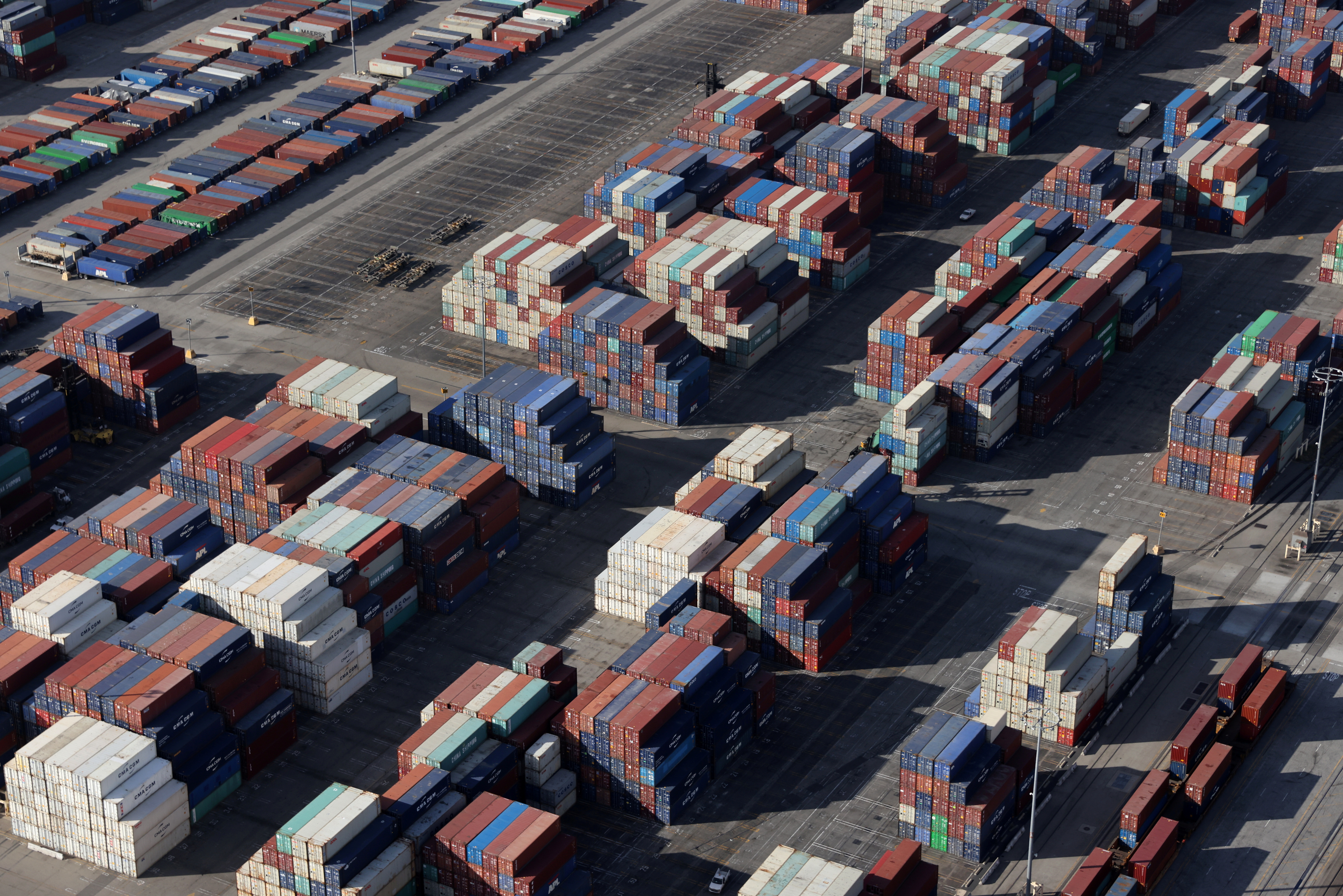 Shipping containers sit on the dock at a container terminal at the Port of Long Beach-Port of Los Angeles complex, amid the coronavirus disease (COVID-19) pandemic, in Los Angeles, California, U.S., April 7, 2021. REUTERS/Lucy Nicholson/File Photo