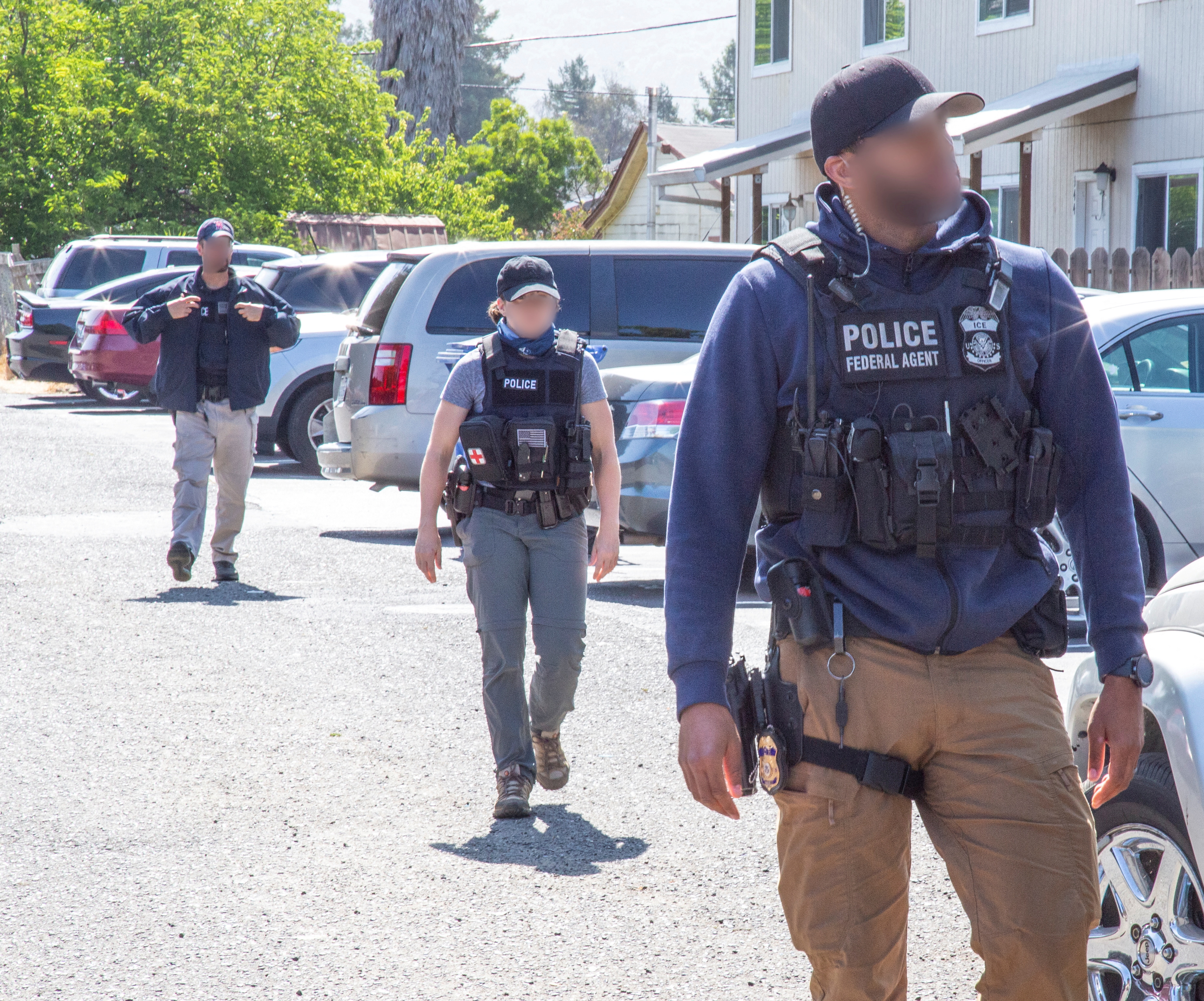 U.S. Immigration and Customs Enforcement officers carry out a raid in San Francisco