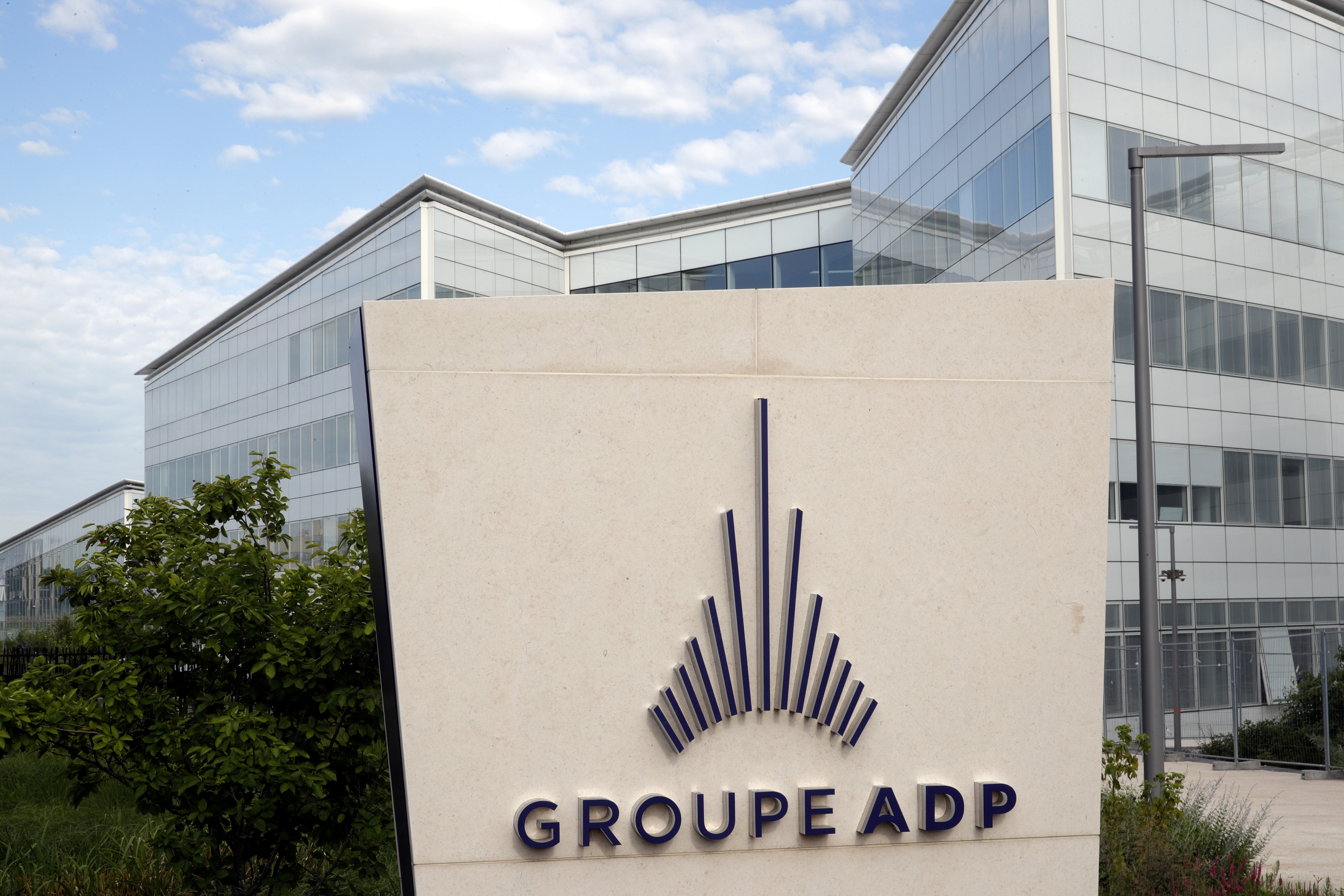 A logo of Groupe ADP (Aeroports de Paris) is seen at the entrance of their headquarters at the Paris Charles de Gaulle airport in Roissy