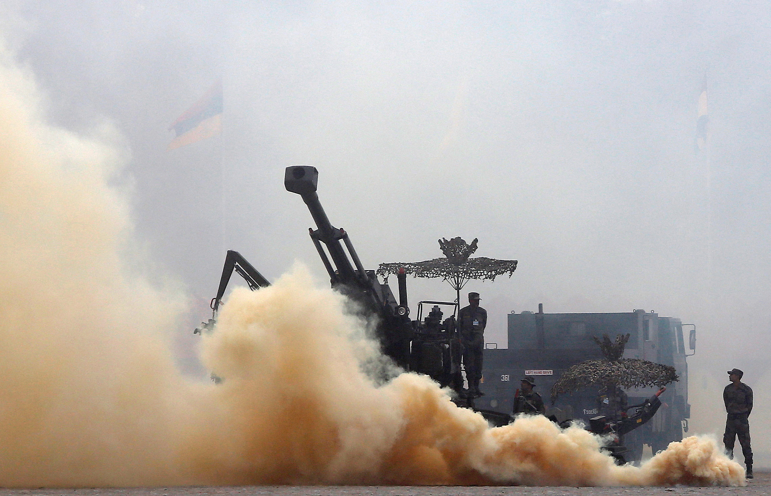 Indian Army soldiers participate in a mock drill exercise during the Army Day parade in New Delhi