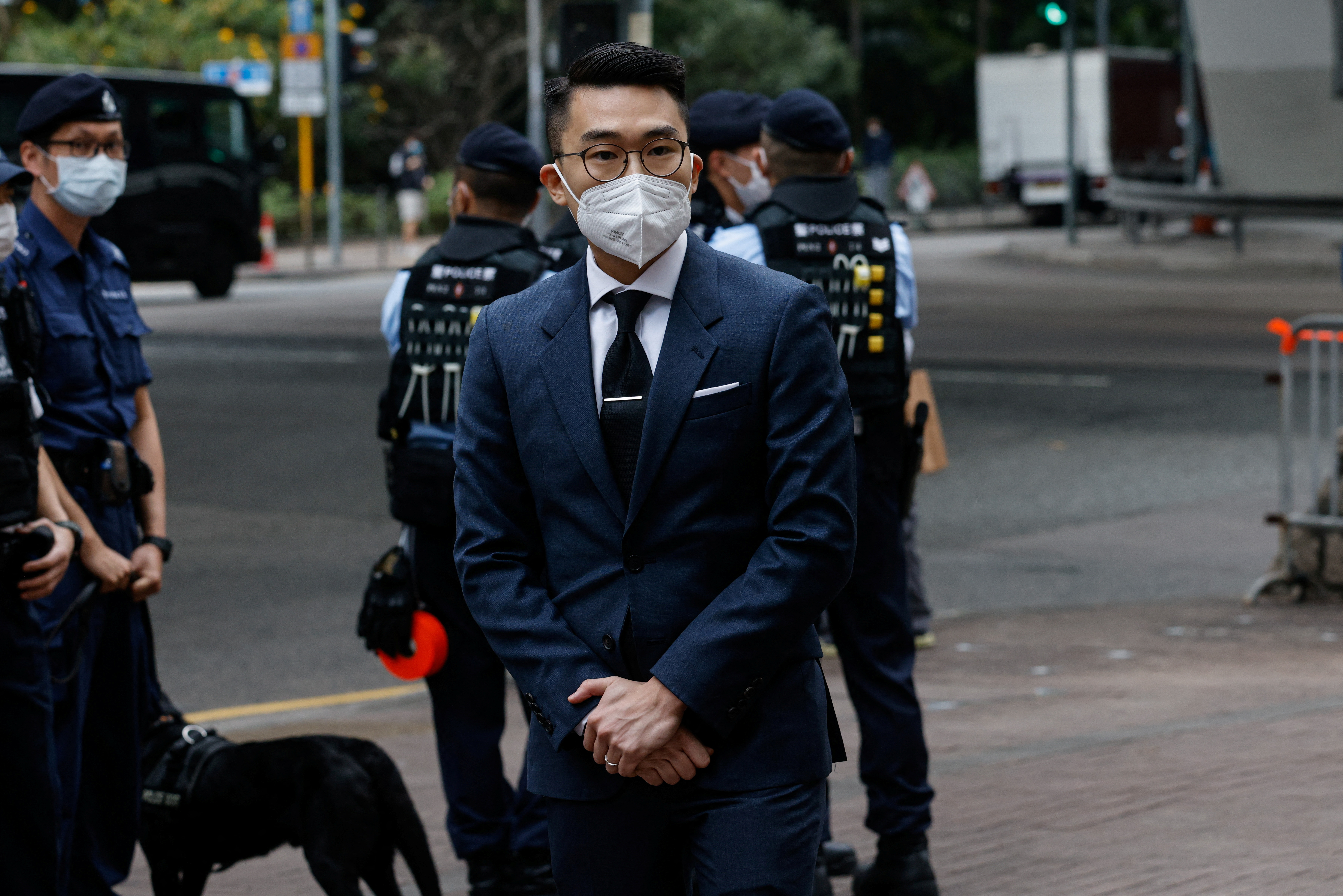 Michael Pang Cheuk-kei, one of the 47 pro-democracy activists charged with conspiracy to commit subversion under the national security law, arrives at the West Kowloon Magistrates' Courts building in Hong Kong