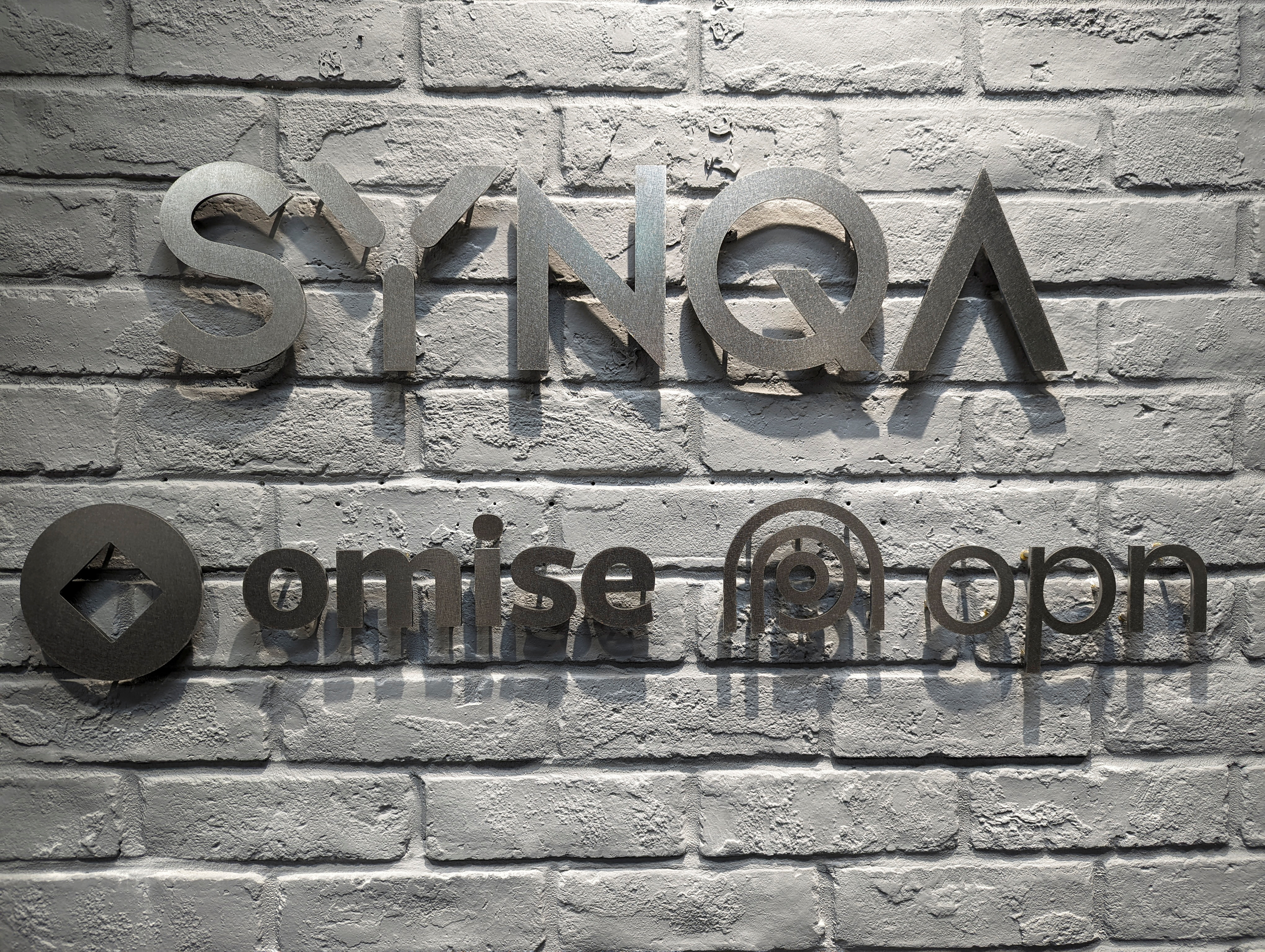 The logo of startup Opn, formely Synqa, is pictured at the company office in Tokyo