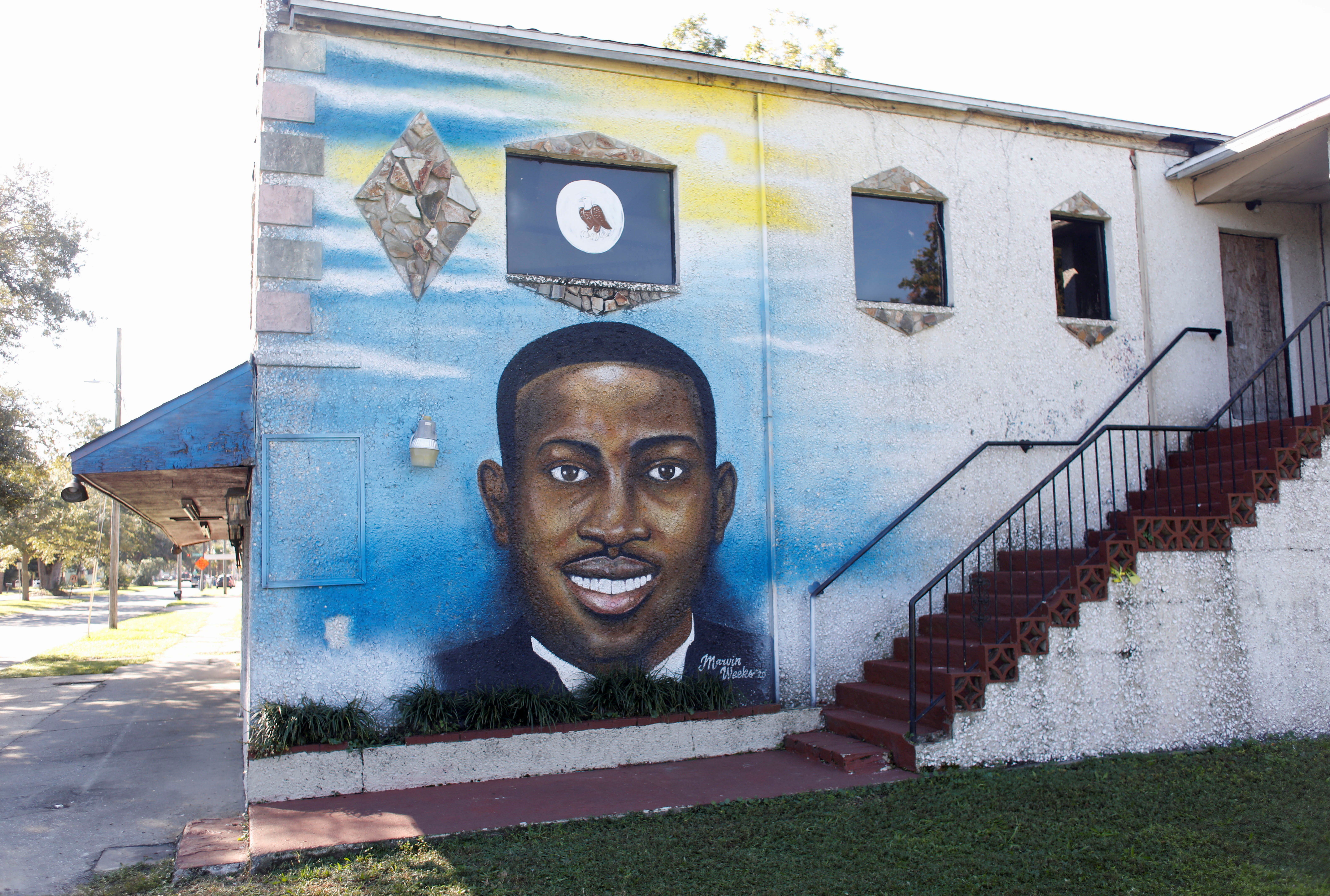 A mural of Ahmaud Arbery is painted on the side of The Brunswick African American Cultural Center in downtown Brunswick
